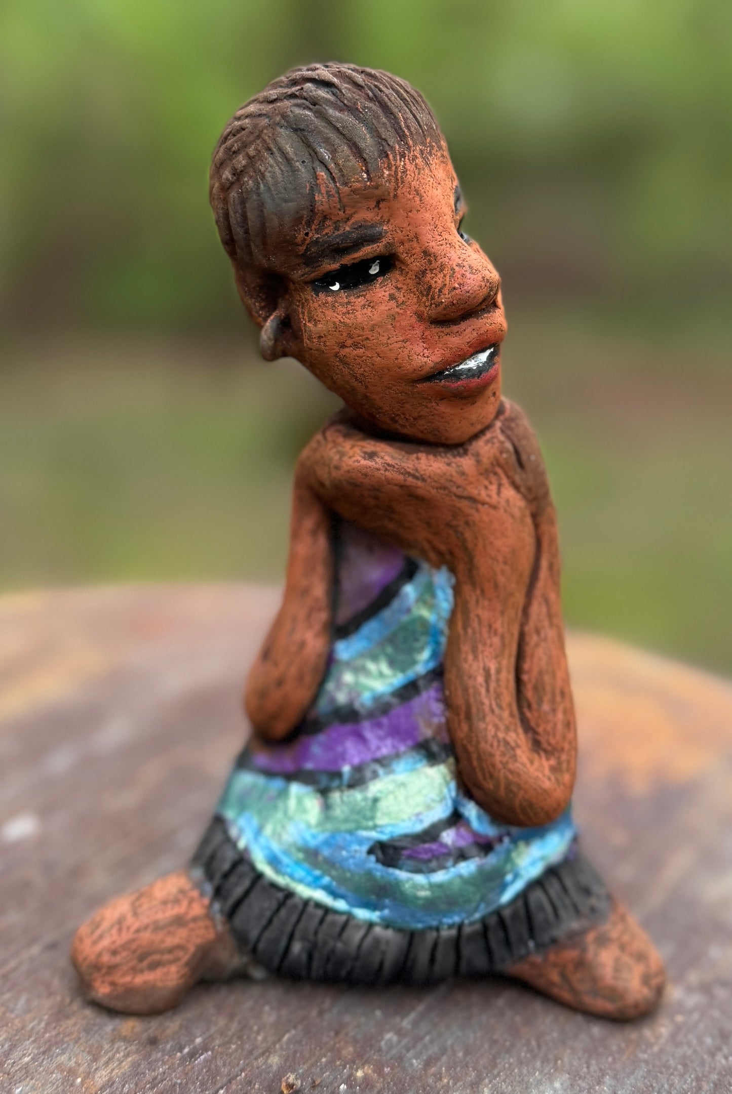 Say hello to Pam, the daring figurine standing at 6" x 4" x 3" and weighing a mere 10 ozs. Adorned in a striking striped dress and with her coiled hair as her crown, Pam exudes boldness and bravery as she sits in a yoga pose, radiating curiosity. Embark on an adventure with the Herdew Collection and feel the exhilaration of free shipping and our customer-friendly return policy. Don't let this unique piece slip away! <p> </p>