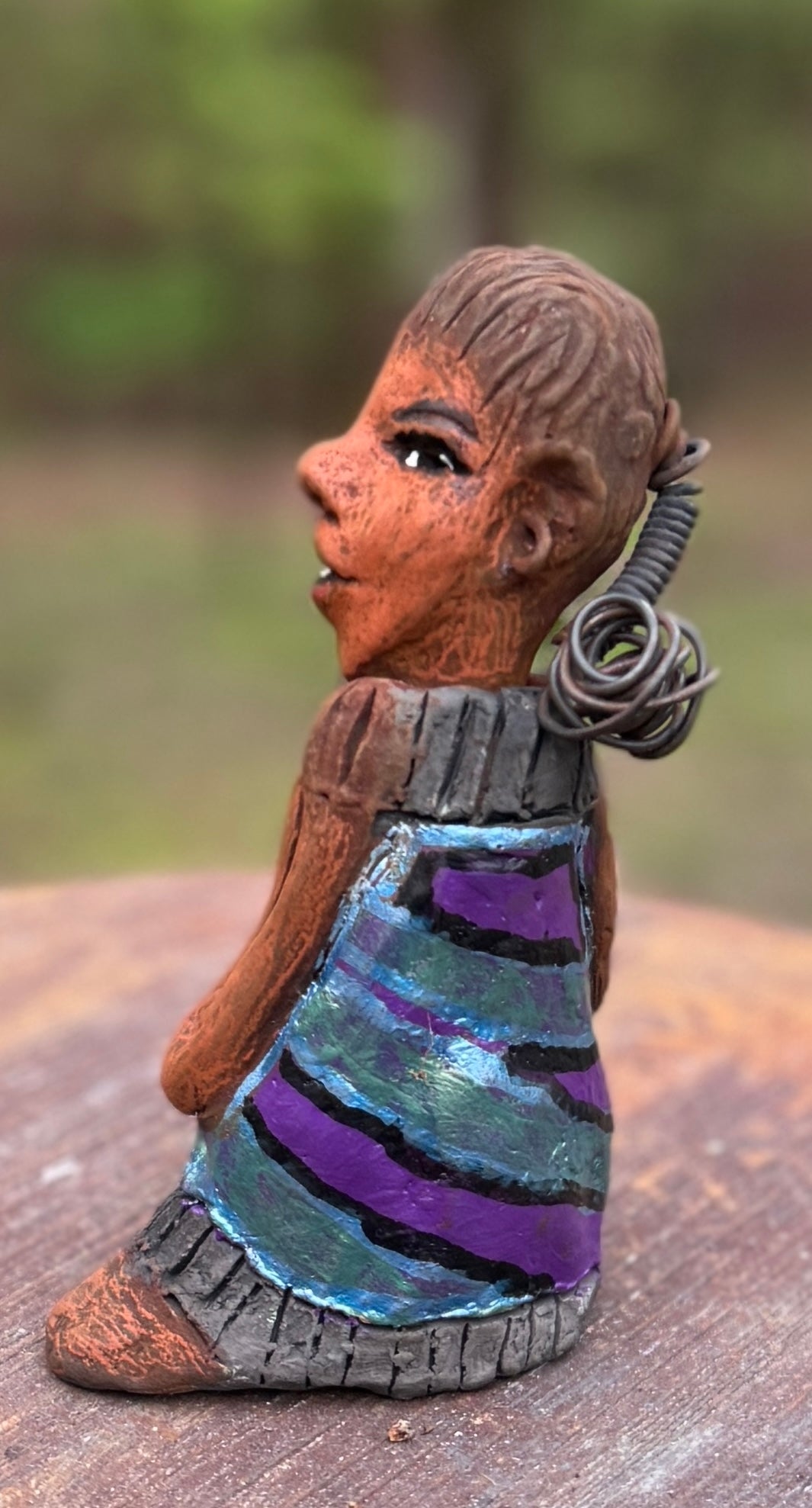 Say hello to Pam, the daring figurine standing at 6" x 4" x 3" and weighing a mere 10 ozs. Adorned in a striking striped dress and with her coiled hair as her crown, Pam exudes boldness and bravery as she sits in a yoga pose, radiating curiosity. Embark on an adventure with the Herdew Collection and feel the exhilaration of free shipping and our customer-friendly return policy. Don't let this unique piece slip away! <p> </p>
