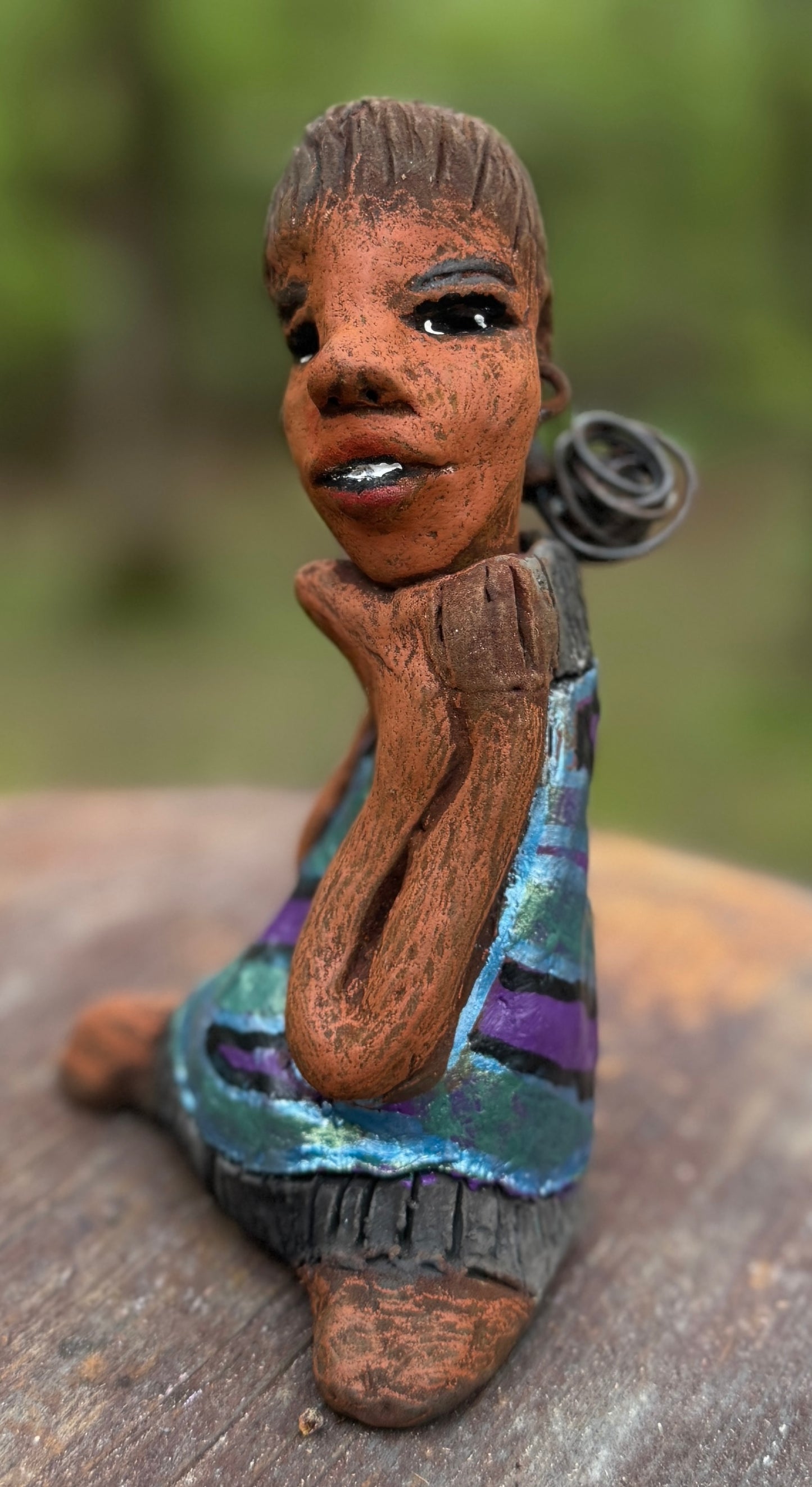 Say hello to Pam, the daring figurine standing at 6" x 4" x 3" and weighing a mere 10 ozs. Adorned in a striking striped dress and with her coiled hair as her crown, Pam exudes boldness and bravery as she sits in a yoga pose, radiating curiosity. Embark on an adventure with the Herdew Collection and feel the exhilaration of free shipping and our customer-friendly return policy. Don't let this unique piece slip away! <p> </p>