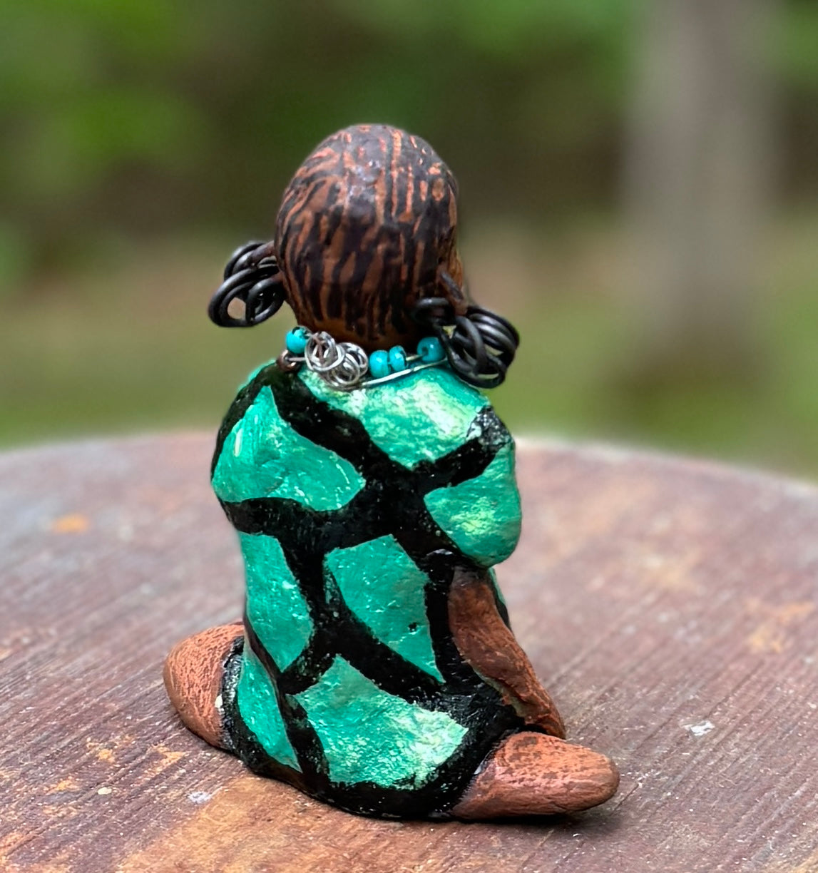 Discover Nala, the bold figurine standing at 4.5" tall and weighing only 5.6 ozs, adorned in a striking black and green African print dress. With her hair styled in coils and her hands calmly resting under her head in a yoga pose, Nala emanates confidence. Join the Herdew Collection and embark on an exciting journey with our complimentary shipping and customer-friendly return policy. Don't hesitate to claim this unique treasure!