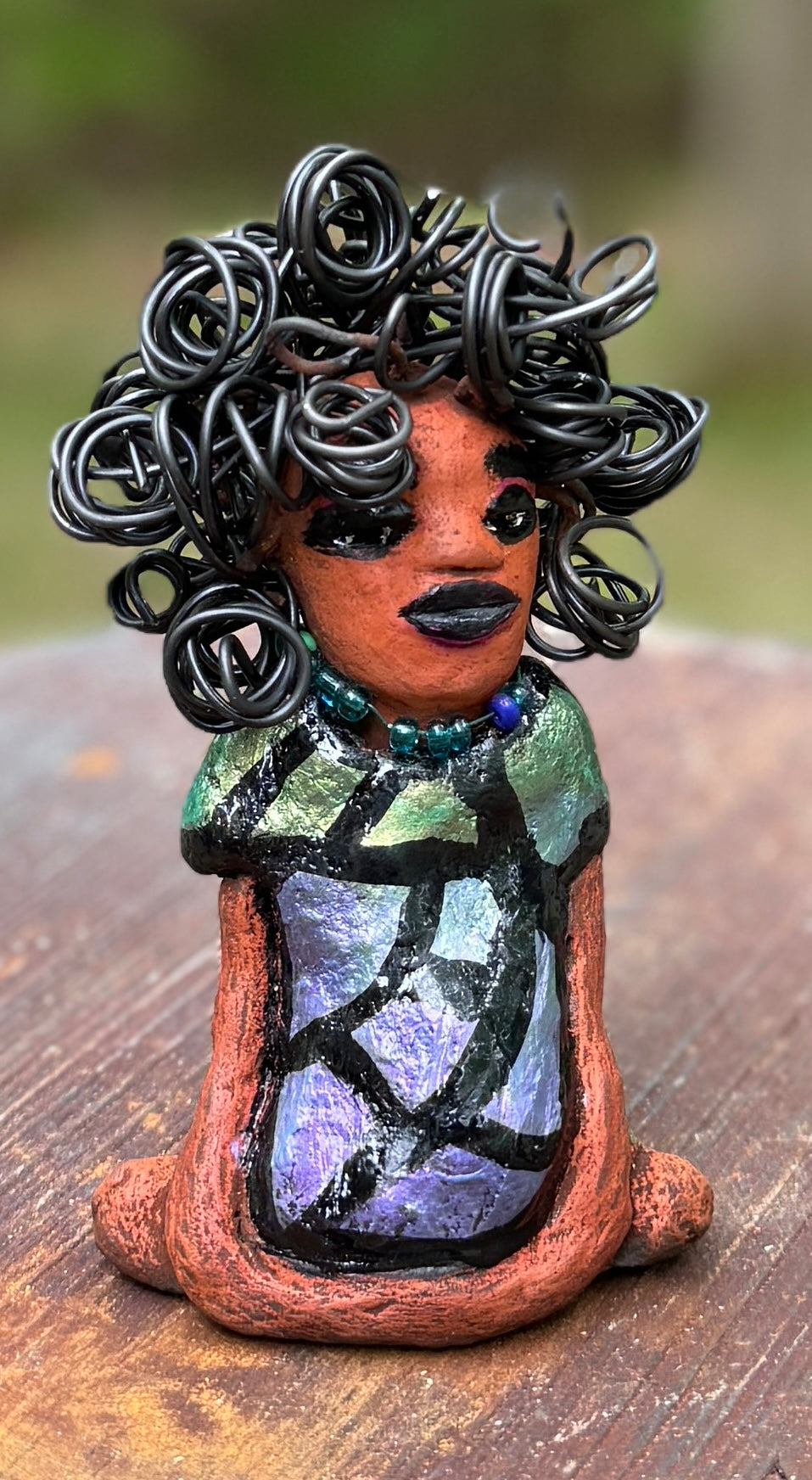 <p><span>Discover Taci, the bold figurine standing at 5.5" tall and weighing only 8.6 ozs, adorned in a striking black and green African print dress. With her hair styled in coils and her hands calmly resting in a yoga pose, Taci emanates confidence. Join the Herdew Collection and embark on an exciting journey with our complimentary shipping and customer-friendly return policy. Don't hesitate to claim this unique treasure!</span></p> <p> </p>