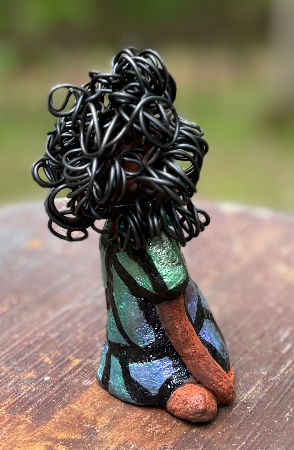 <p><span>Discover Taci, the bold figurine standing at 5.5" tall and weighing only 8.6 ozs, adorned in a striking black and green African print dress. With her hair styled in coils and her hands calmly resting in a yoga pose, Taci emanates confidence. Join the Herdew Collection and embark on an exciting journey with our complimentary shipping and customer-friendly return policy. Don't hesitate to claim this unique treasure!</span></p> <p> </p>