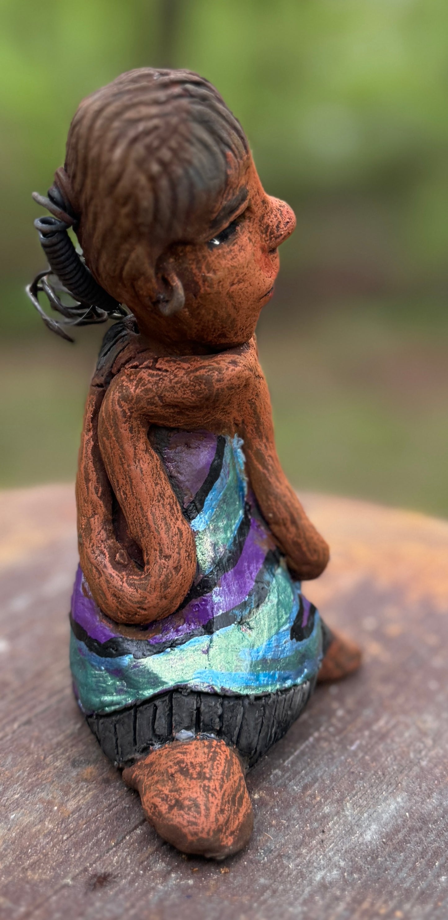 Say hello to Pam, the daring figurine standing at 6" x 4" x 3" and weighing a mere 10 ozs. Adorned in a striking striped dress and with her coiled hair as her crown, Pam exudes boldness and bravery as she sits in a yoga pose, radiating curiosity. Embark on an adventure with the Herdew Collection and feel the exhilaration of free shipping and our customer-friendly return policy. Don't let this unique piece slip away! <p> </p>