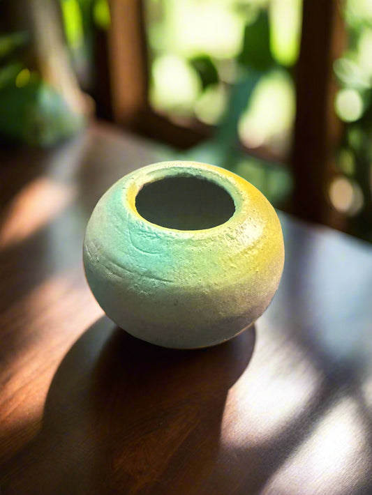 Featuring a 2-inch opening, this elegant Blue Green & Gold Vase boasts a matte finish, weighing 10 ounces and measuring 3 1/2 inches in height, with a width and depth of 4 inches.
