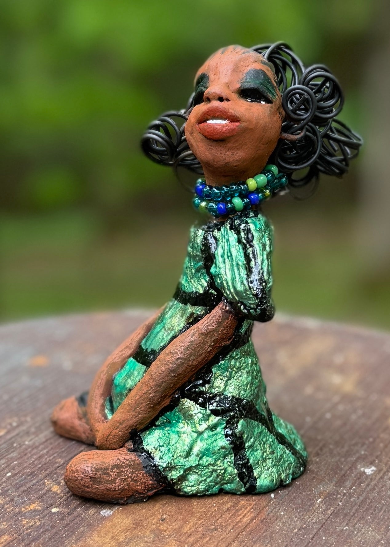 <p>Say hello to Sophia, the daring figurine standing at 5.5" x 4" x 3" and weighing a mere 10 ozs. Adorned in a striking striped dress and with her coiled hair as her crown, Sophia exudes boldness and bravery as she sits in a yoga pose, radiating curiosity. Embark on an adventure with the Herdew Collection and feel the exhilaration of free shipping and our customer-friendly return policy. Don't let this unique piece slip away!</p> <p> </p> <meta charset="UTF-8"> <h2 style="text-align: center;"></h2>