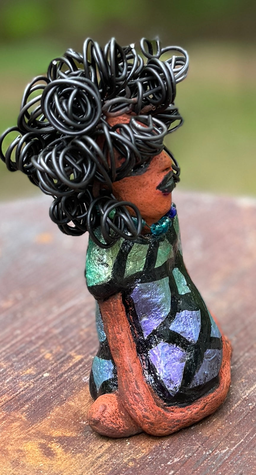 <p><span>Discover Taci, the bold figurine standing at 5.5" tall and weighing only 8.6 ozs, adorned in a striking black and green African print dress. With her hair styled in coils and her hands calmly resting in a yoga pose, Taci emanates confidence. Join the Herdew Collection and embark on an exciting journey with our complimentary shipping and customer-friendly return policy. Don't hesitate to claim this unique treasure!</span></p> <p> </p>