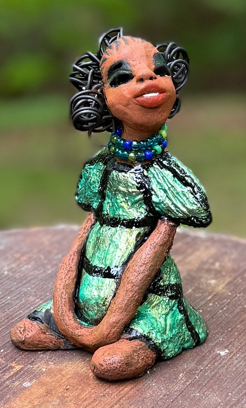 <p>Say hello to Sophia, the daring figurine standing at 5.5" x 4" x 3" and weighing a mere 10 ozs. Adorned in a striking striped dress and with her coiled hair as her crown, Sophia exudes boldness and bravery as she sits in a yoga pose, radiating curiosity. Embark on an adventure with the Herdew Collection and feel the exhilaration of free shipping and our customer-friendly return policy. Don't let this unique piece slip away!</p> <p> </p> <meta charset="UTF-8"> <h2 style="text-align: center;"></h2>