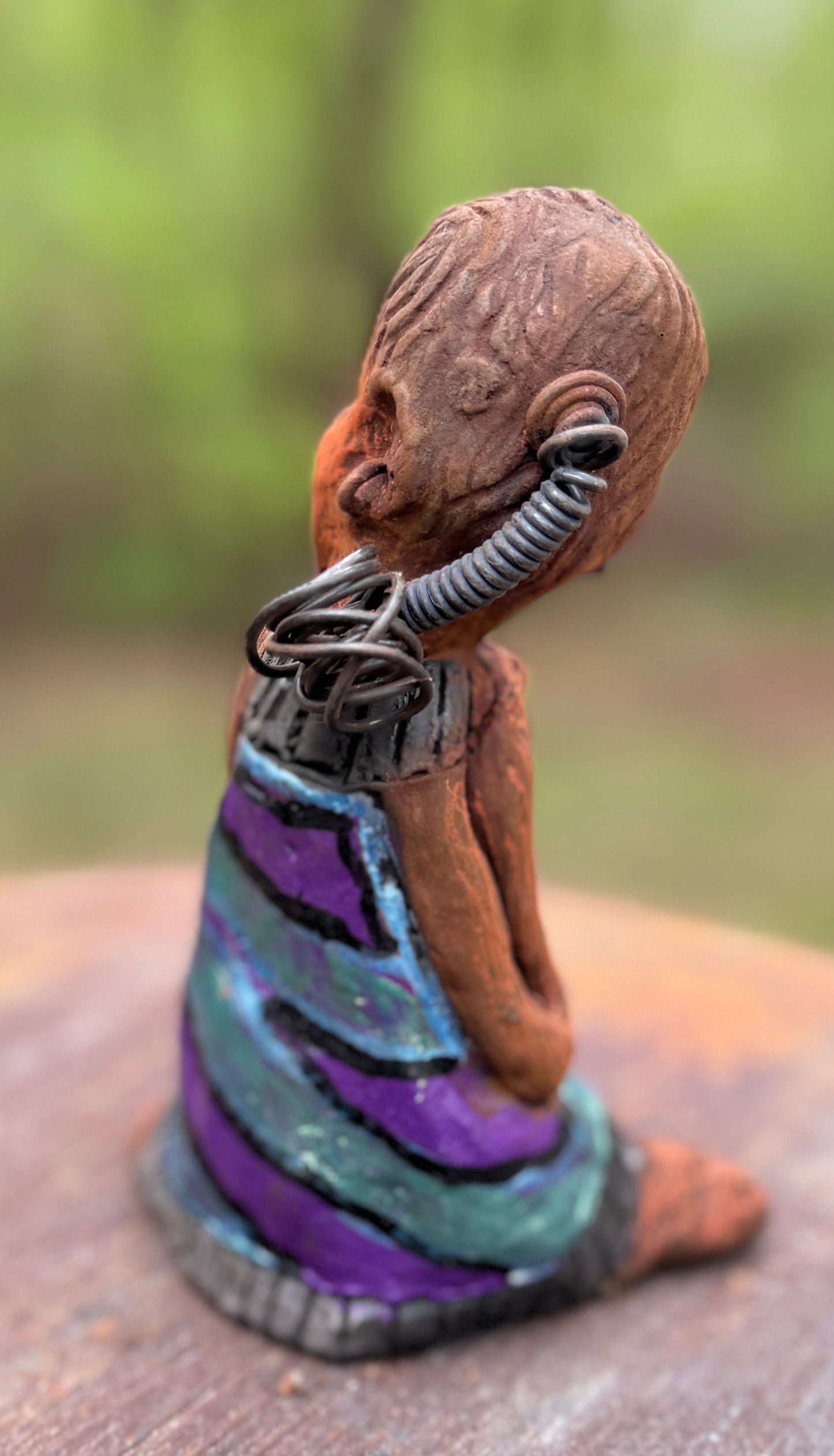 Say hello to Pam, the daring figurine standing at 6" x 4" x 3" and weighing a mere 10 ozs. Adorned in a striking striped dress and with her coiled hair as her crown, Pam exudes boldness and bravery as she sits in a yoga pose, radiating curiosity. Embark on an adventure with the Herdew Collection and feel the exhilaration of free shipping and our customer-friendly return policy. Don't let this unique piece slip away! <p> </p>