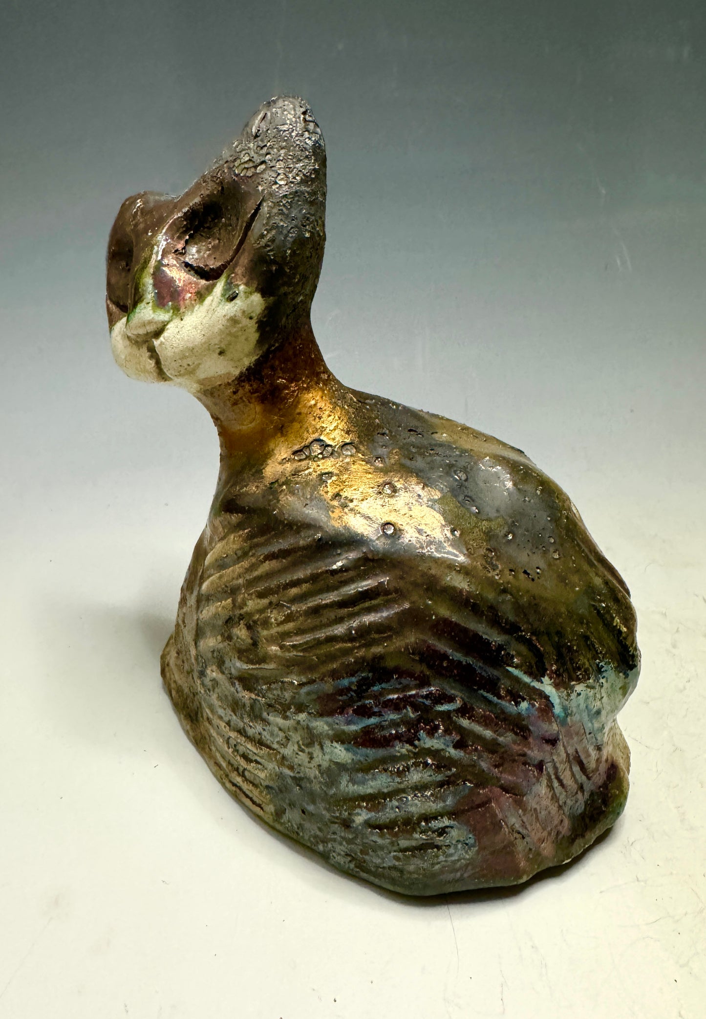 She's a pet with major 6" x 5" x 5" personality! This tiny wonder packs a powerful punch, boasting a stunning metallic patina and a lightweight design. Let her bring joy to any room with her endearing kitty cheer - she's sure to win your heart!