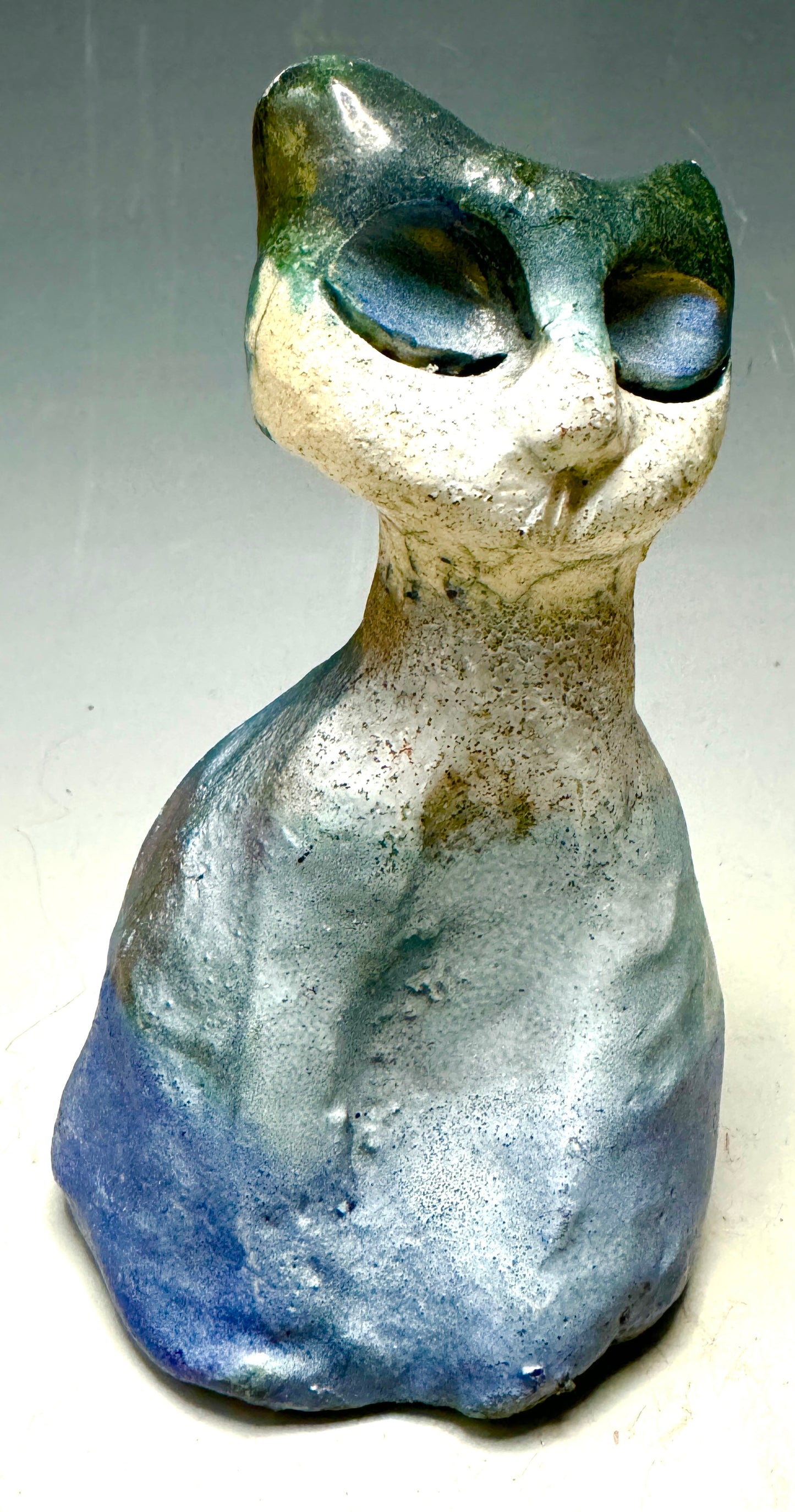 Welcome HK-5, the most adorably purr-fect feline friend about! At only 5.5' x 4" x 4", she's totally lightweight and ready to make any room happier. Her happy tri color shimmering and her 8 oz. mass sure to bring a smile to your face. Invite bliss into your home with this delightful kitty-cat cutie!