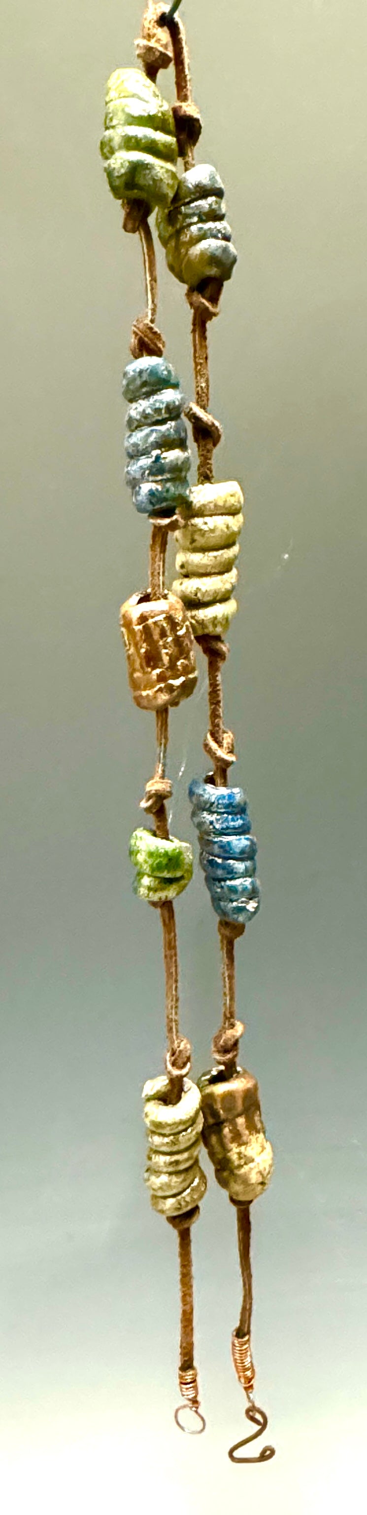 This 26” stunner features nine handmade raku beads on a brown lace cord, combining captivating design, luxurious texture, and stylish color combos to bring a bold dose of sophistication to any wardrobe. Its stand-out length makes this piece an artistic statement and a fashionable must-have!
