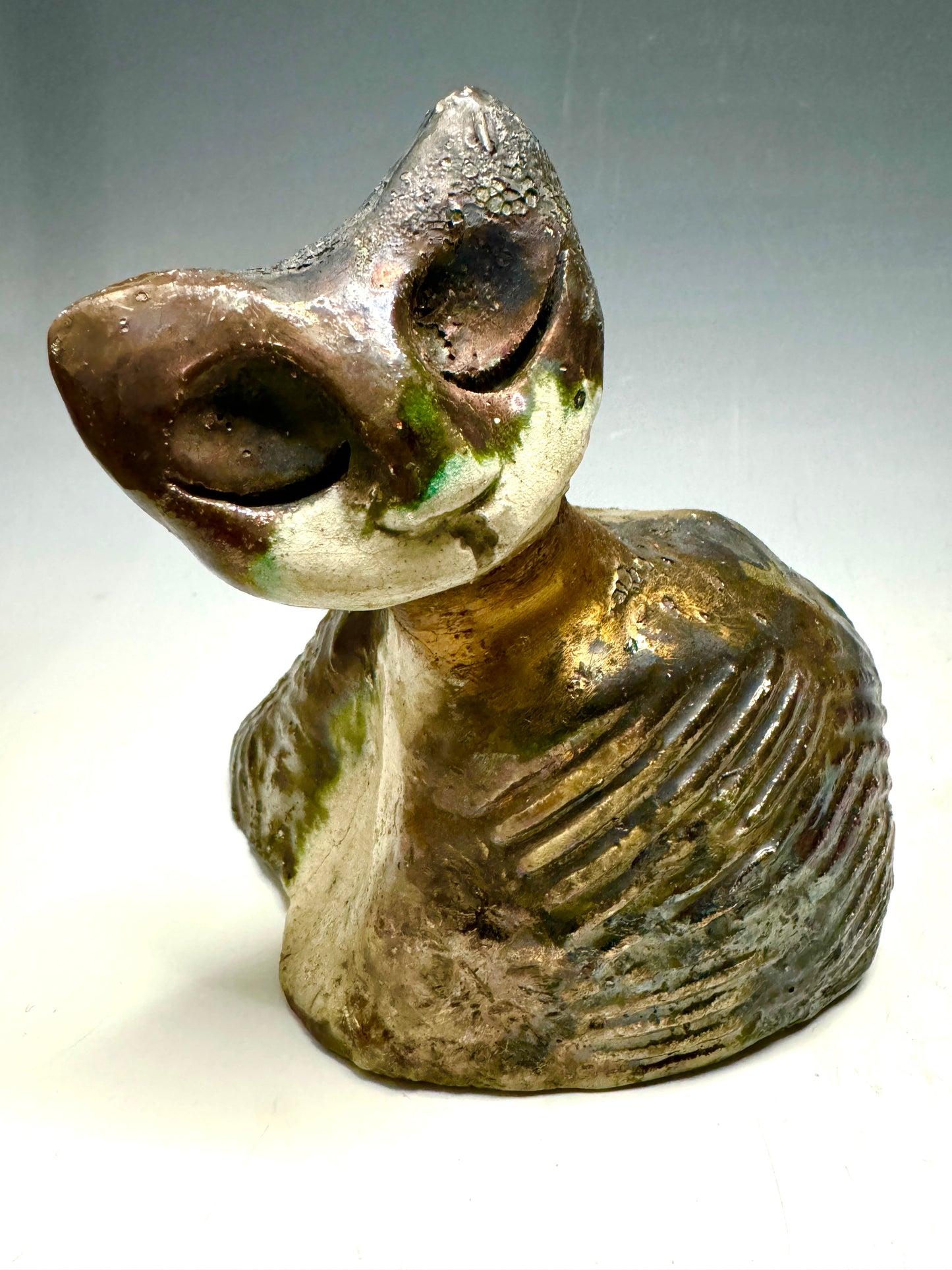 She's a pet with major 6" x 5" x 5" personality! This tiny wonder packs a powerful punch, boasting a stunning metallic patina and a lightweight design. Let her bring joy to any room with her endearing kitty cheer - she's sure to win your heart!