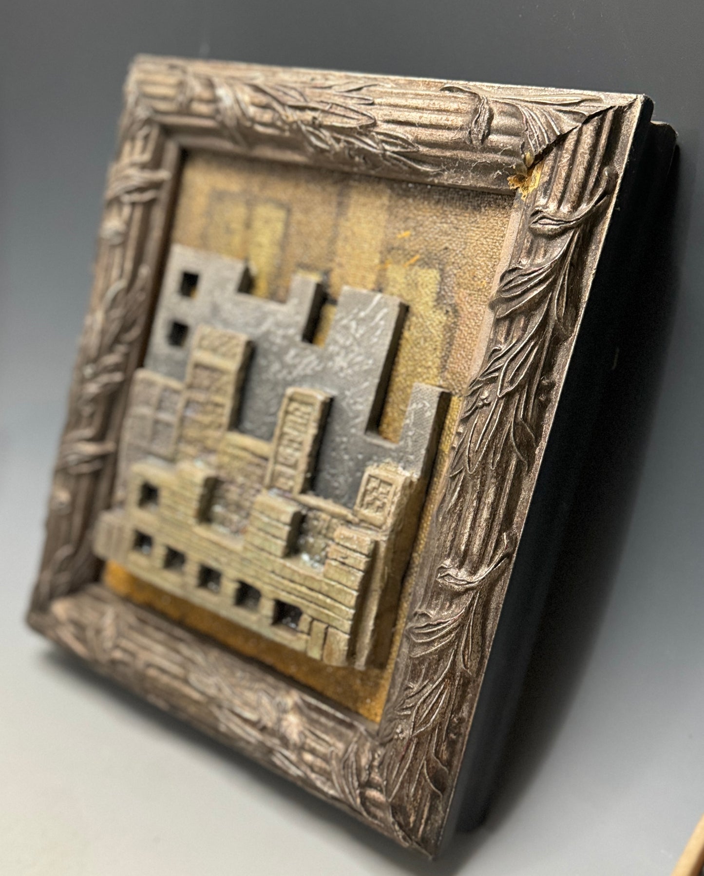 I visited New York about a year ago and I was just amazed at the beauty and the splendor of that city. I had to capture it once I returned home. This 3d painting/raku sculpture features a portion of that humongous awesome place that I observed. It is framed on a 11" x 13' x 3" frame that compliments. This 3D painting/raku sculpture beautifully captures the city's vibrancy and grandeur, artfully to make an eye-catching display in any room.