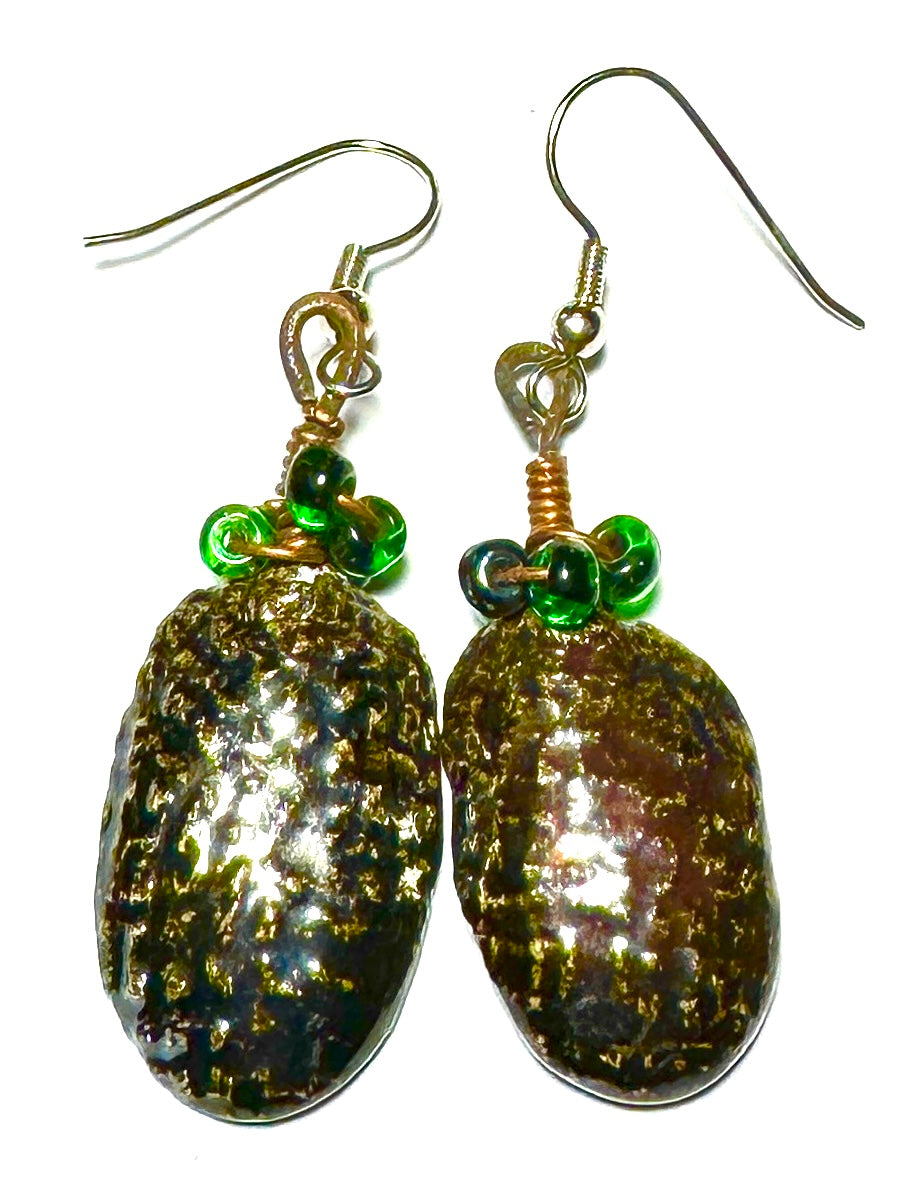 Raku Fired Earrings Shimmery Copper Luster Glazed on both sides 1/2 ounce The Raku Fired Earrings have a unique copper luster glaze that adds a special touch to any outfit. They come in a convenient 1/2 ounce pack, so you can easily take them on the go.