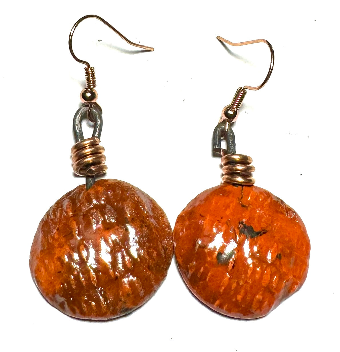Raku Fired Earrings Shimmery Copper Luster Glazed on both sides 1/2 ounce The Raku Fired Earrings have a unique copper luster glaze that adds a special touch to any outfit. They come in a convenient 1/2 ounce pack, so you can easily take them on the go.