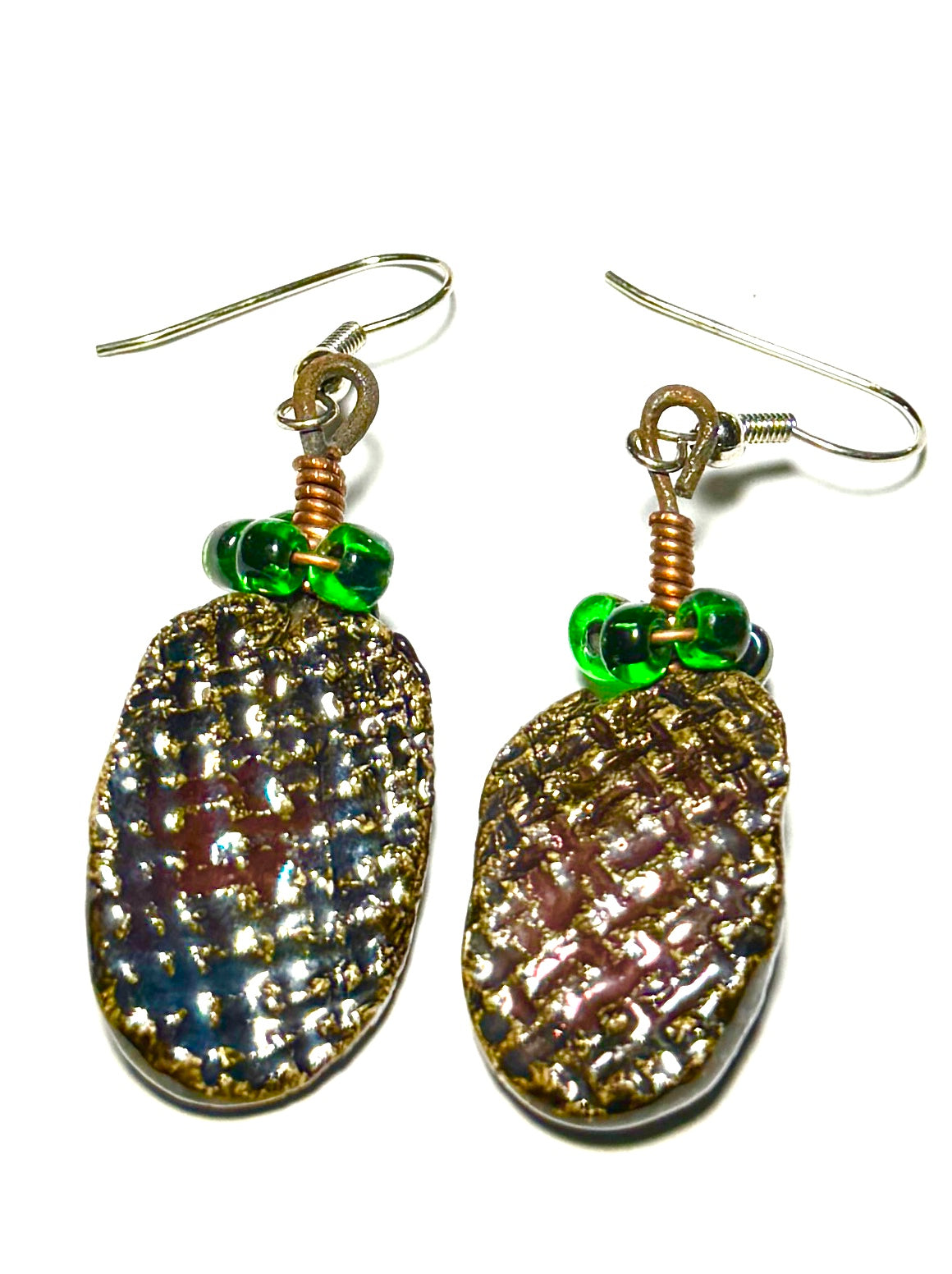 Raku Fired Earrings Shimmery Copper Luster Glazed on both sides 1/2 ounce The Raku Fired Earrings have a unique copper luster glaze that adds a special touch to any outfit. They come in a convenient 1/2 ounce pack, so you can easily take them on the go.
