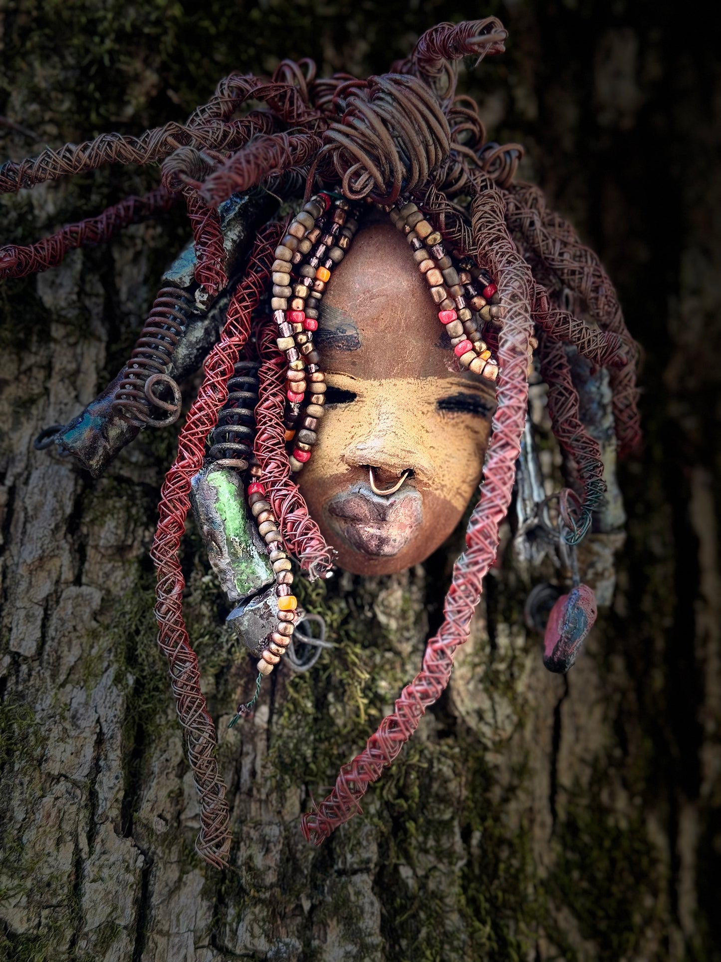 Ayanna is a wise, distinguished youth with a two-tone tribal look. He stands 7" x 10" and weighs 1 lb. His braided hairstyle features handmade textured metallic beads plus a twist of coiled 16 gauge wire. Questions? Send an instant message or chat with me.