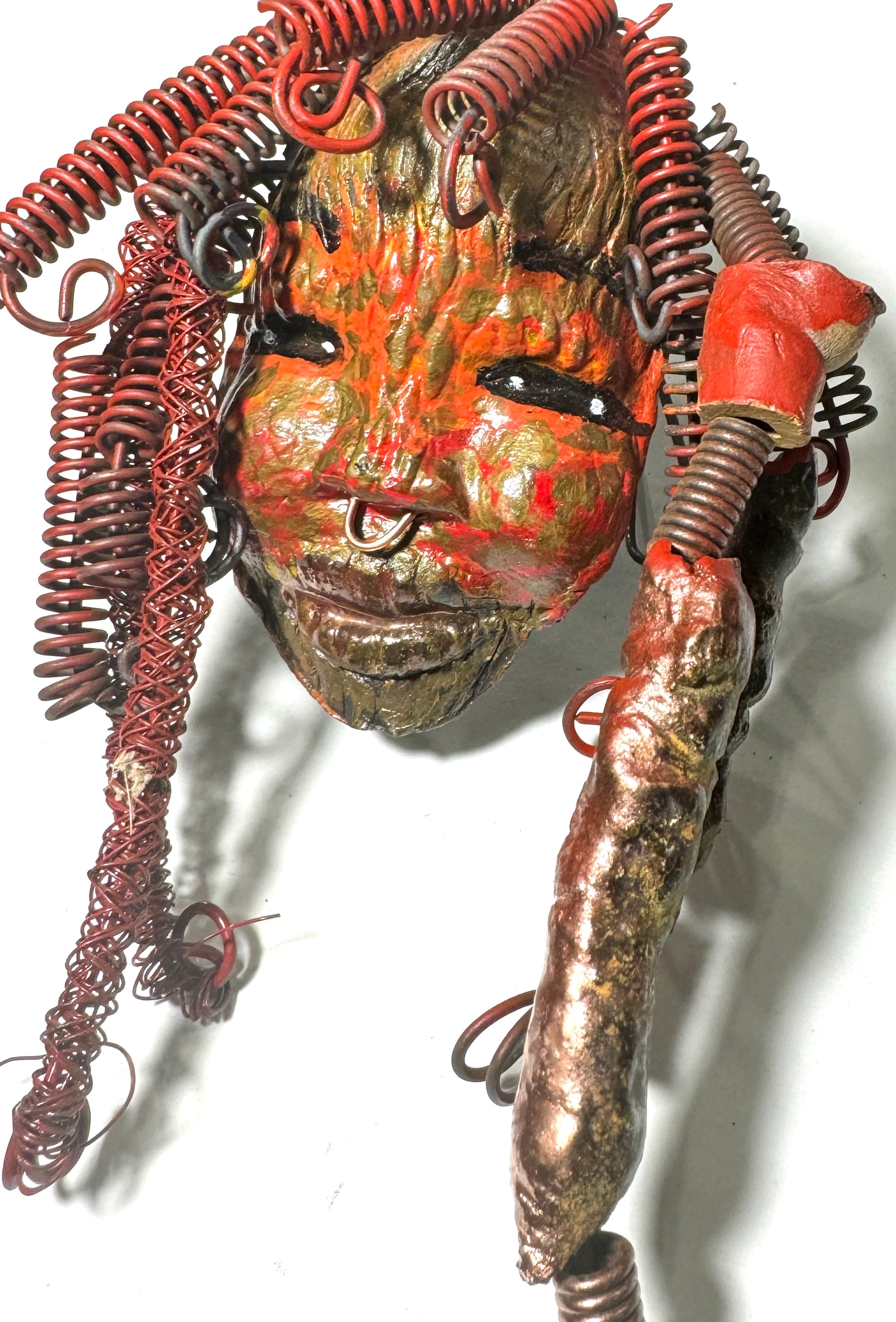Randi features plentiful curls and textures across her vibrant face, complemented by her copper nose-ring and over 10 feet of 16 and 24 gauge wire. She is the perfect gift for the holidays or an ideal starting piece for any home.