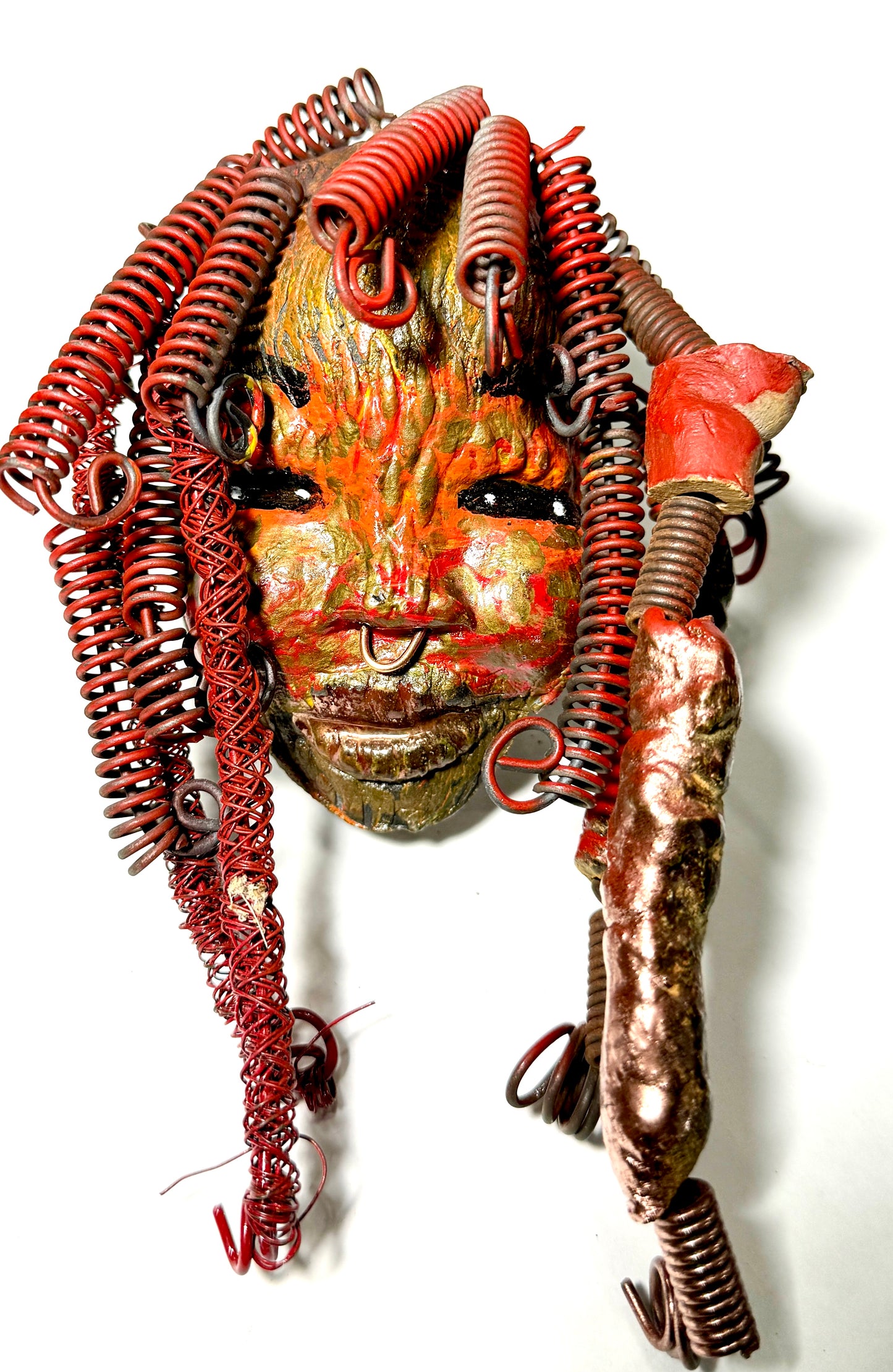 Randi features plentiful curls and textures across her vibrant face, complemented by her copper nose-ring and over 10 feet of 16 and 24 gauge wire. She is the perfect gift for the holidays or an ideal starting piece for any home.