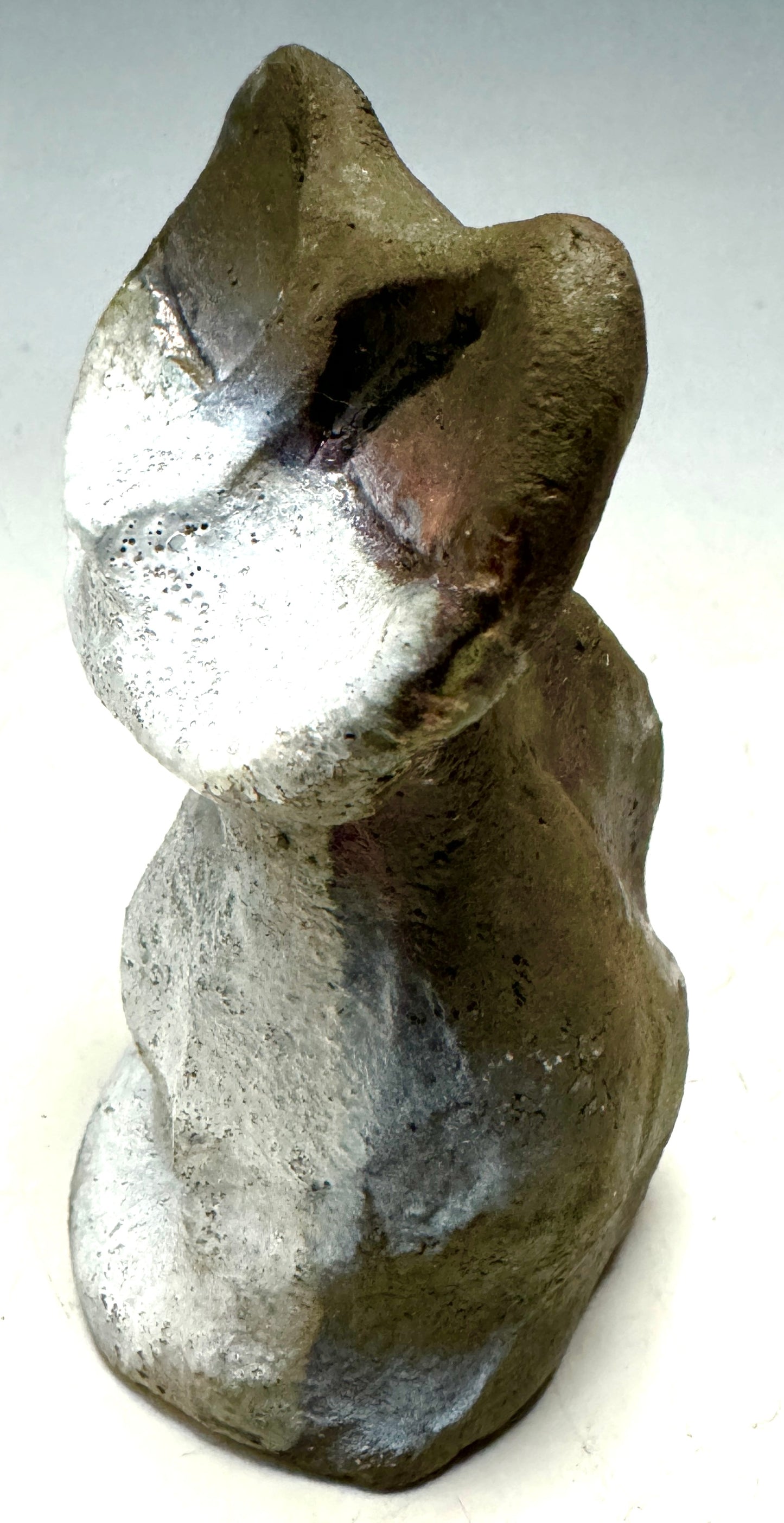 Welcome HK-3, the most adorably purr-fect feline friend about! At only 4' x 2" x 2", she's totally lightweight and ready to make any room happier. Her happy gray color shimmering and her 5 oz. mass sure to bring a smile to your face. Invite bliss into your home with this delightful kitty-cat cutie!