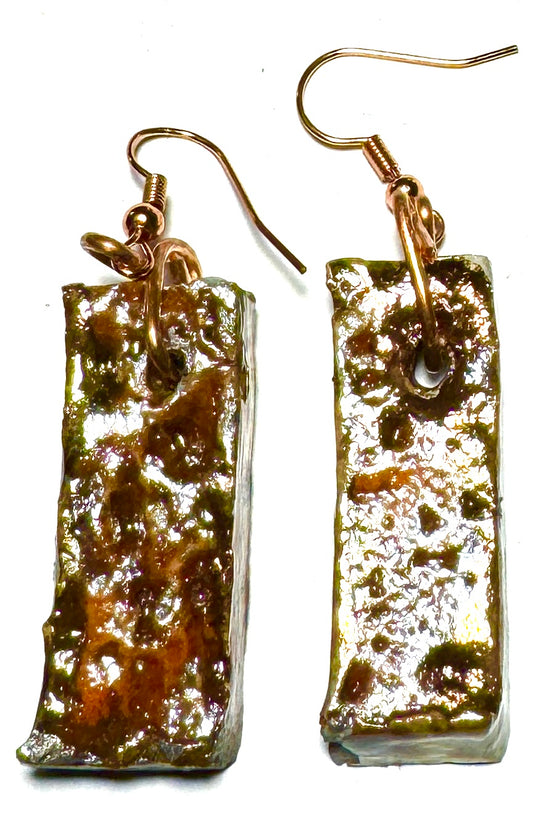 Take a daring fashion risk with the ER-15 earrings! These lightweight rectangle earrings feature a unique shimmery copper luster that adds an eye-catching sparkle to any look. Delicately crafted at 1/2 ounce, they're designed to go anywhere. Be bold and make a statement!