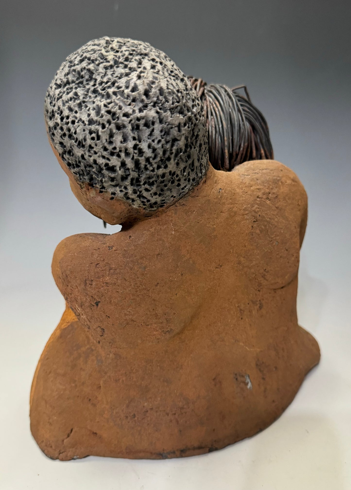 What a Sweet Couple... Is she Expecting?! I Love You More stands 10" x 9" x 5" and weighs 5.04 lbs. It has a honey brown complexion, with long loving arms that interlock in affection. Her hair is wire while his is made of clay, making I Love You More unique and perfect for any home.