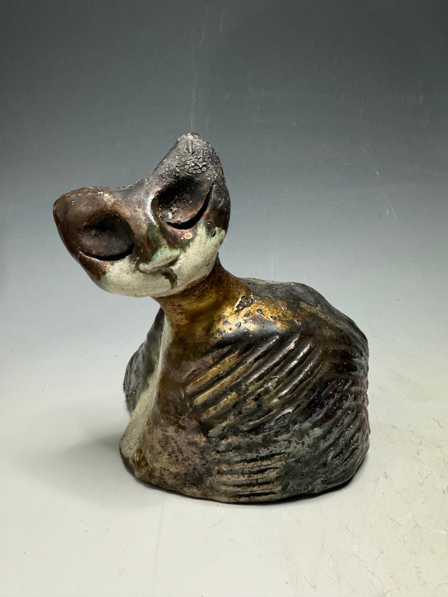 She's a pet with major 6" x 5" x 5" personality! This tiny wonder packs a powerful punch, boasting a stunning metallic patina and a lightweight design. Let her bring joy to any room with her endearing kitty cheer - she's sure to win your heart!