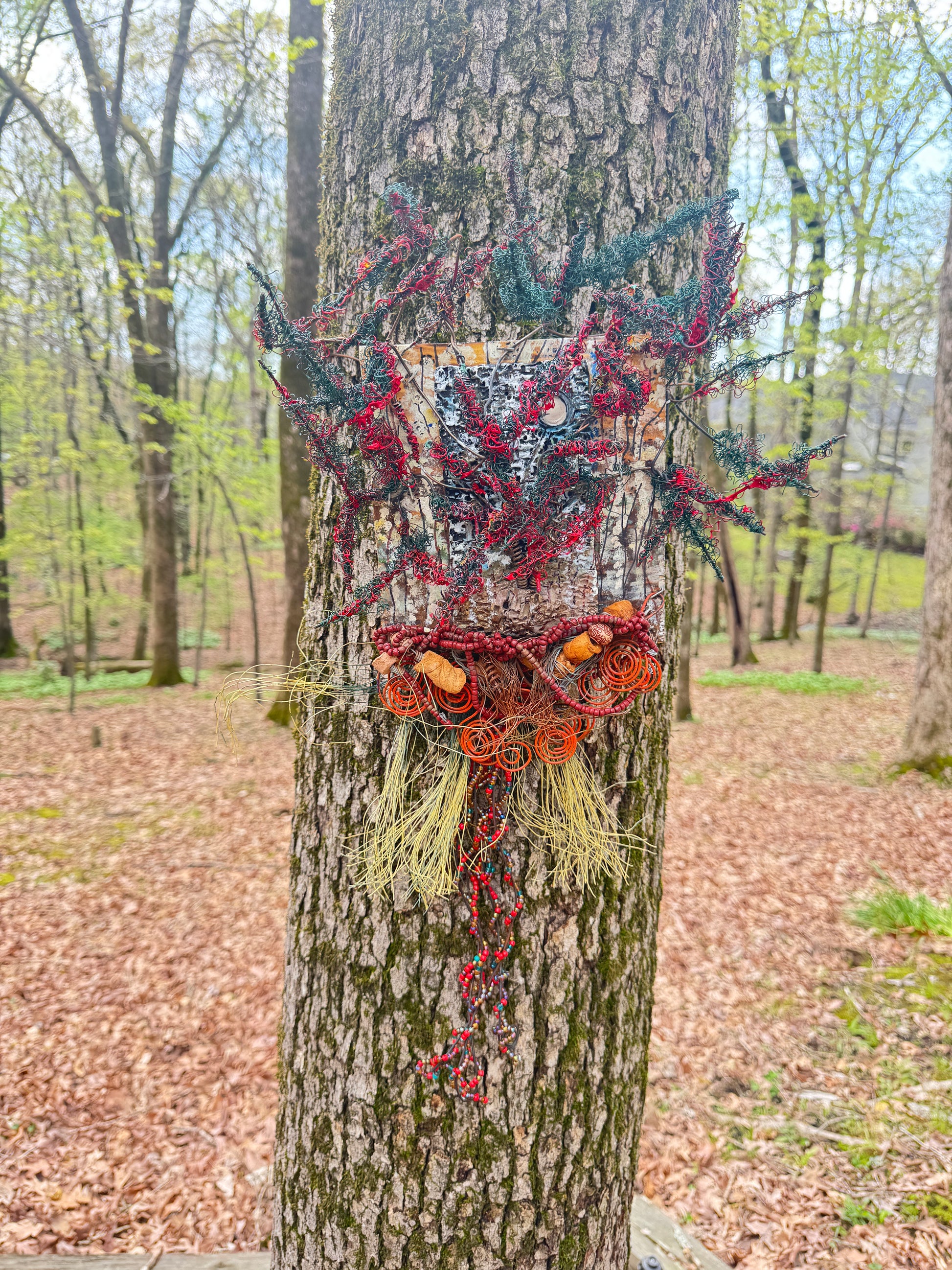 Explore the enchanting realm of Scarlet Verdant Spires through this unique, multimedia landscape. Comprised of a 20"x16" canvas adorned with a blend of 16- and 24-gauge wire and stunning Raku fire beads, as well as a captivating RAKU fired and hand-painted texture tile resting on a 7"x5" wooden base, this piece weighs 1.8 lbs. Experience the radiant hues of a summer evening as the sun illuminates the lush, red, and verdant foliage.
Experience the enchanting realm of Scarlet Verdant Spires with this unique,