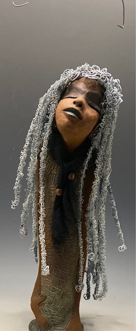 Yvette is one of my BIG girls who wants to understand what's going on!  She stands 18" x 5.5" x 4.5" and weighs 4 lbs. She wears an etched textured copper dress with a black tulle scarf.