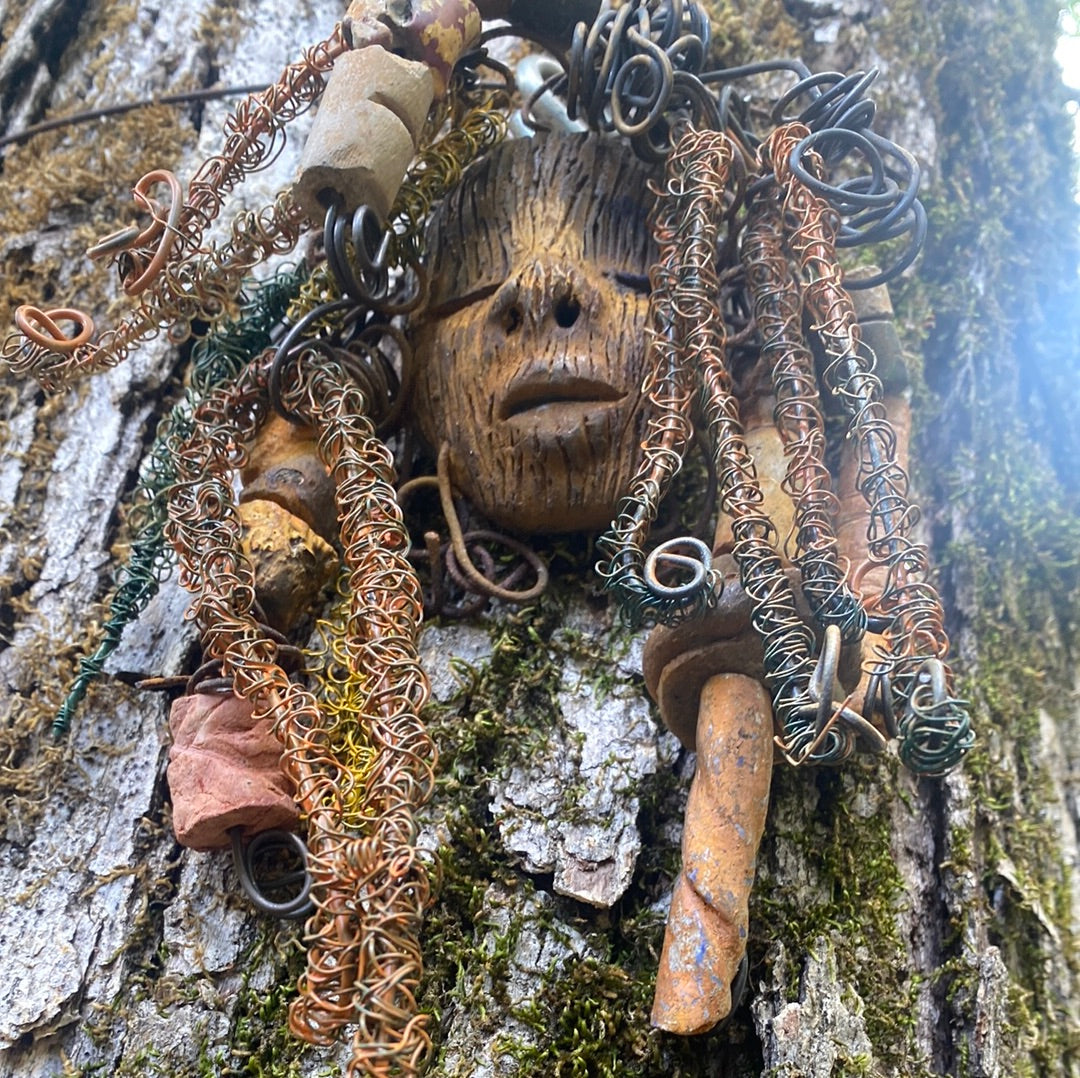 Vetti is 6”x8 ” and weighs 4.6 ozs. She has a two tone copper brown complexion. Vetti has big hair with several spiral coils handmade Raku beads. Over 30 ft of hand twisted 16 and 24 gauge wire!