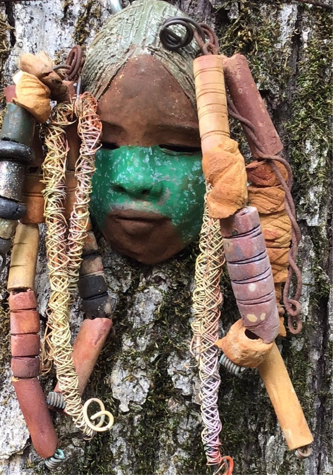 Meet Asha! I started making art soon after seeing authentic African artwork at the Smithsonian Museum of African Art. I was in total awe. Asha was inspired by my visit there. Asha has a two tone green and beige complexion with gold freckles. She is approximately 4" x 6" and weighs 8 ozs. Asha has an aged earthy hairstyle of handmade textured dreadlocks along with twist of coiled 16 gauge wire