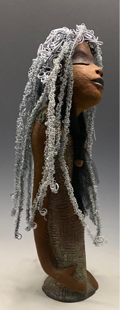Yvette is one of my BIG girls who wants to understand what's going on!  She stands 18" x 5.5" x 4.5" and weighs 4 lbs. She wears an etched textured copper dress with a black tulle scarf.