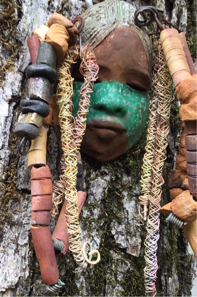 Meet Asha! I started making art soon after seeing authentic African artwork at the Smithsonian Museum of African Art. I was in total awe. Asha was inspired by my visit there. Asha has a two tone green and beige complexion with gold freckles. She is approximately 4" x 6" and weighs 8 ozs. Asha has an aged earthy hairstyle of handmade textured dreadlocks along with twist of coiled 16 gauge wire