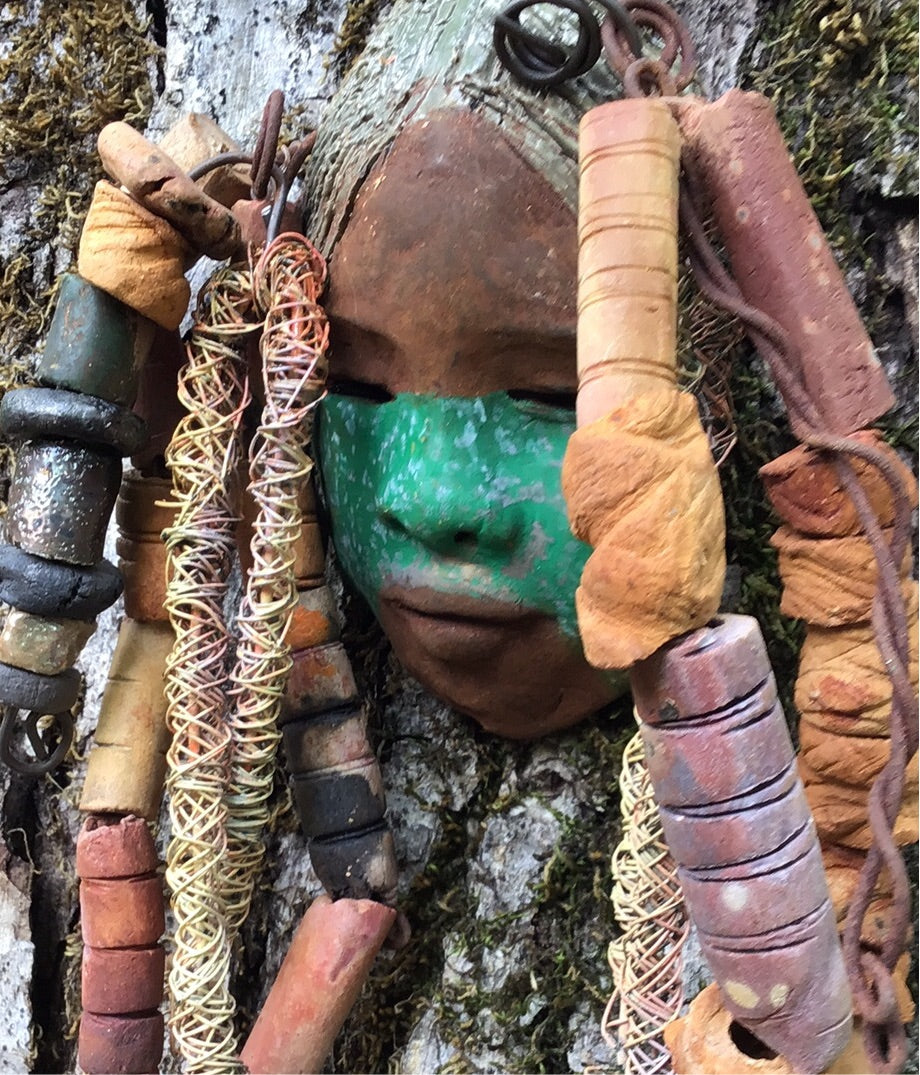 Meet Asha! I started making art soon after seeing authentic African artwork at the Smithsonian Museum of African Art. I was in total awe. Asha was inspired by my visit there. Asha has a two tone green and beige complexion with gold freckles. She is approximately 4" x 6" and weighs 8 ozs. Asha has an aged earthy hairstyle of handmade textured dreadlocks along with twist of coiled 16 gauge wire