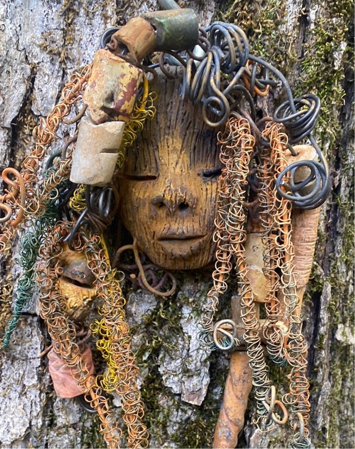 Vetti is 6”x8 ” and weighs 4.6 ozs. She has a two tone copper brown complexion. Vetti has big hair with several spiral coils handmade Raku beads. Over 30 ft of hand twisted 16 and 24 gauge wire!