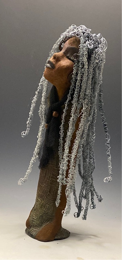 Yvette is one of my BIG girls who wants to understand what's going on! She stands 18" x 5.5" x 4.5" and weighs 4 lbs. She wears an etched textured copper dress with a black tulle scarf.