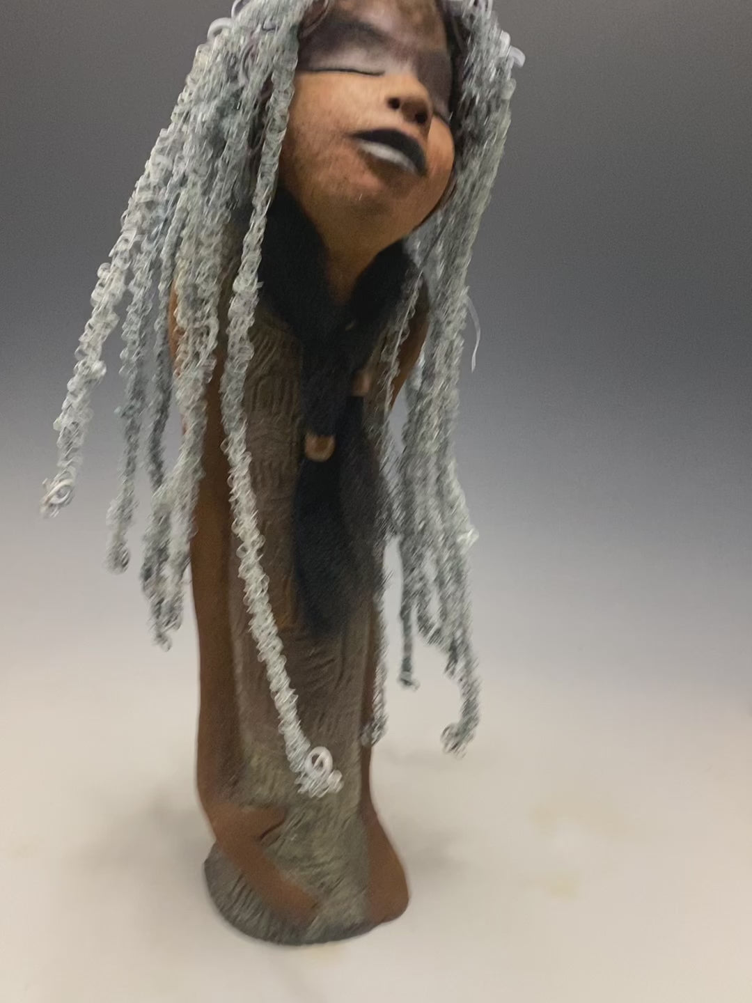 Yvette is one of my BIG girls who wants to understand what's going on!  She stands 18" x 5.5" x 4.5" and weighs 4 lbs. She wears an etched textured copper dress with a black tulle scarf.