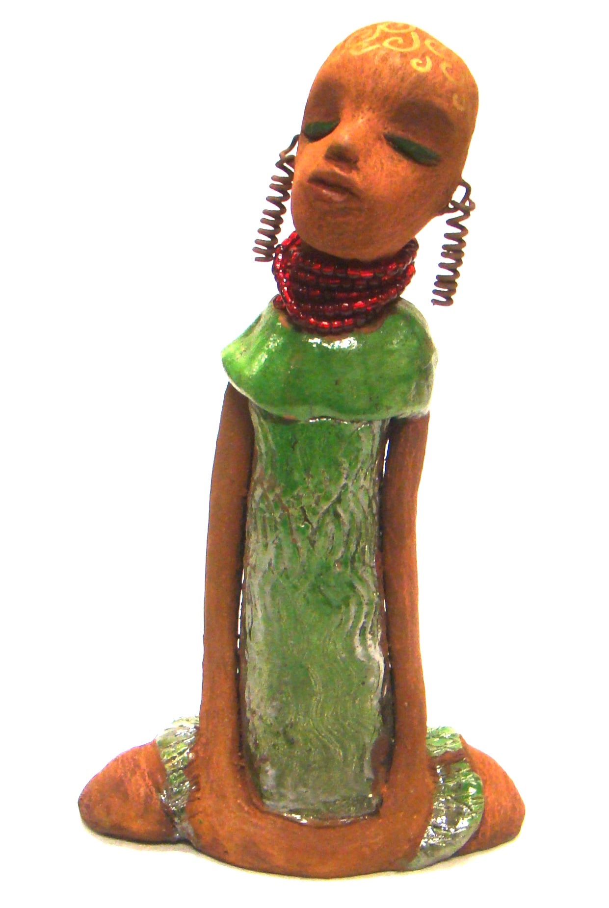 Amaya stands 10" x 6" x 2.5" and weighs 1.03 lbs.     She has a lovely honey brown complexion.     Her hair is drawn with spiral gold ink.     Amaya long loving arms rest beside her alligator green dress.     She wears a strand of ruby red beads with spiral wire ear rings.     Amaya is a sophisticated lady that will grace your home.     Free Shipping!