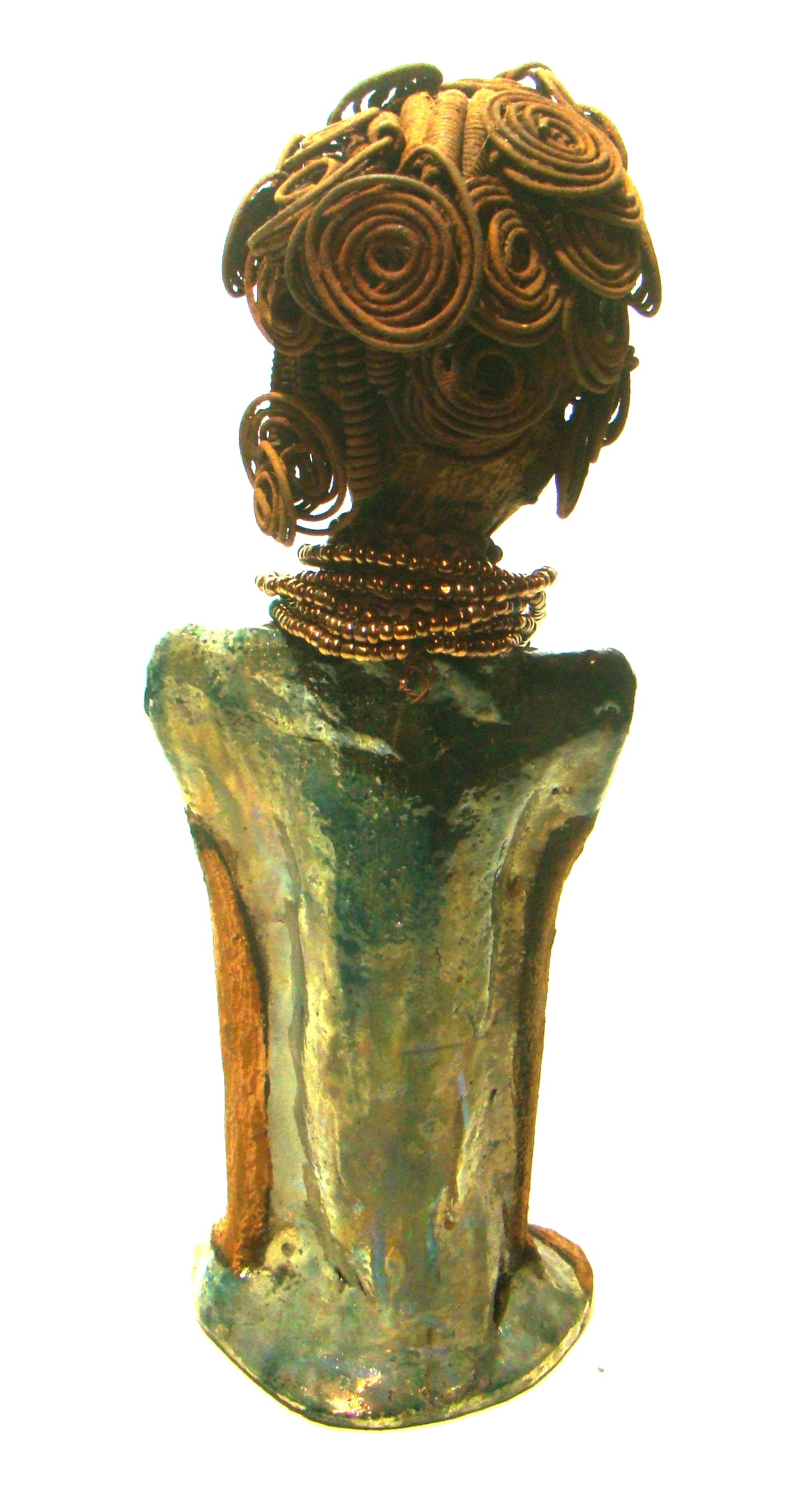 Sherri stands 13' x 4" x 2.5" and weighs 3.05 lbs. She has over 25 feet of wire curls and coils. Sherri has a sweet honey brown complexion. Her dress is a metallic multi colored green with an amber beaded necklace and scarf. Sherri has the familiar long loving arms at her side.