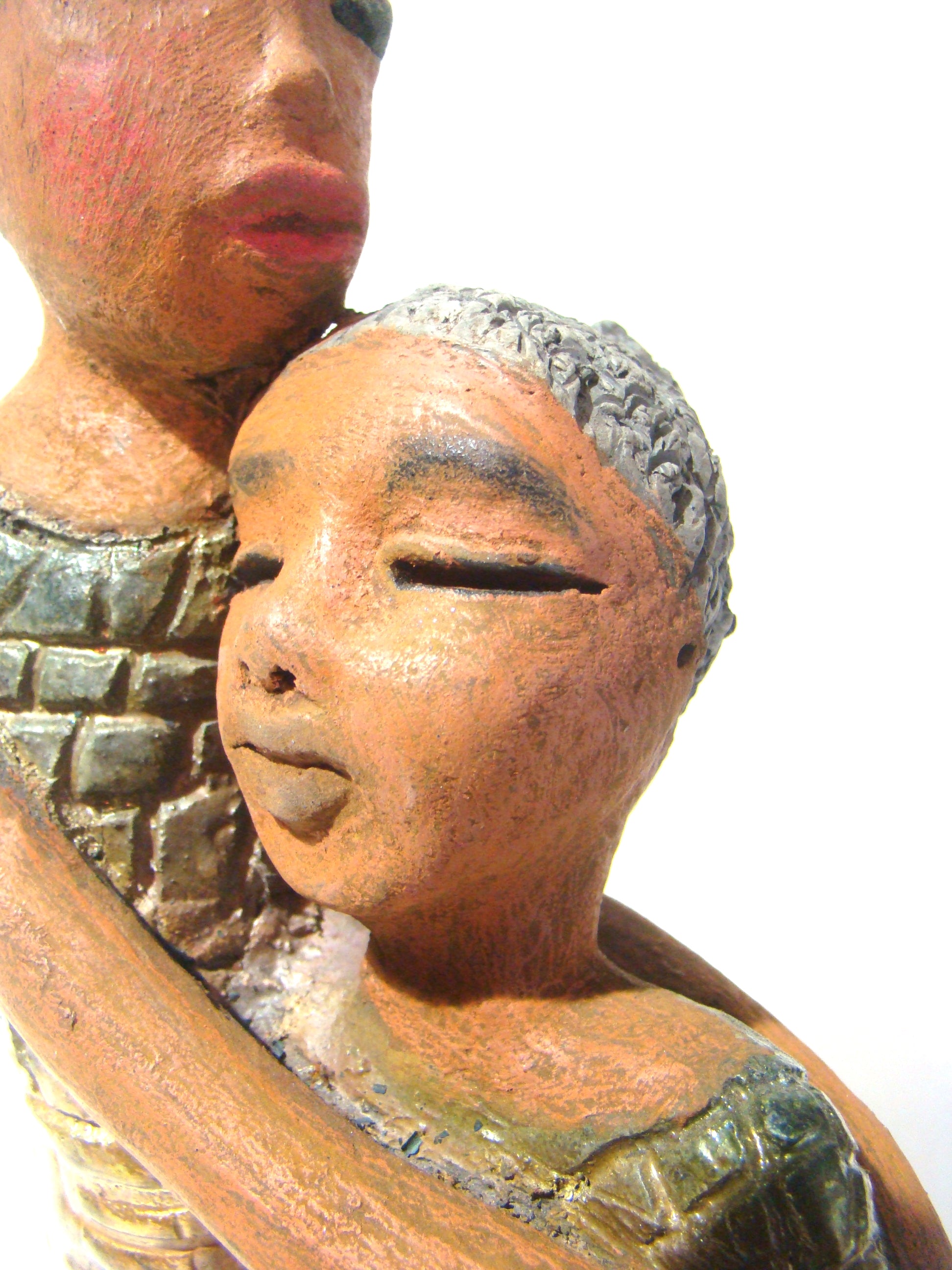 Girl Talk with my Mom stands 13' x 7" x 4" and weighs 14.lbs. They were raku fired etched metallic copper dresses. Their hair is made of clay and raised into an etched bun. They have lovely honey brown complexions and long loving arms. Girl Talk with my Mom would remind one of those special moments in tim