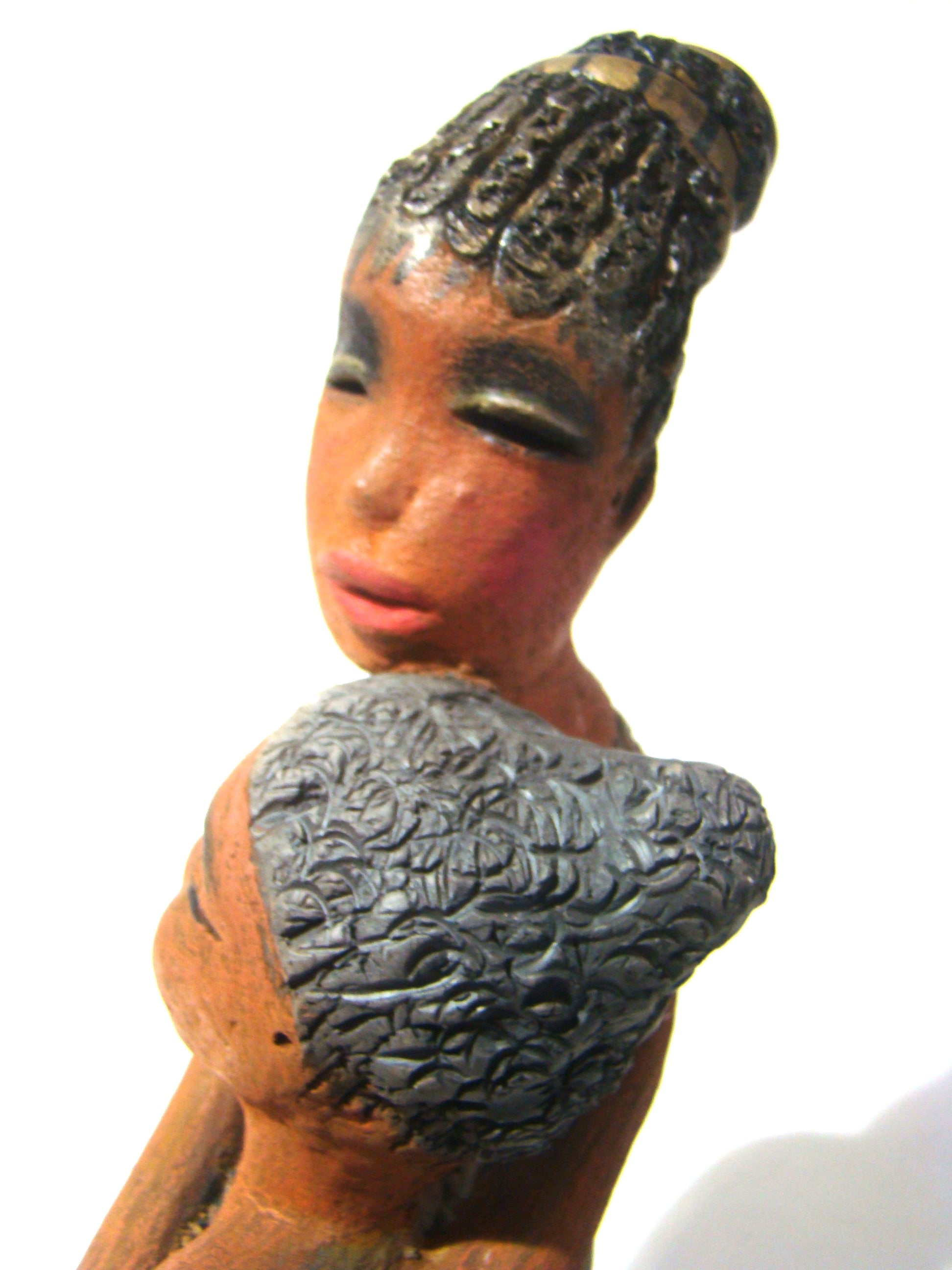 Girl Talk with my Mom stands 13' x 7" x 4" and weighs 14.lbs. They were raku fired etched metallic copper dresses. Their hair is made of clay and raised into an etched bun. They have lovely honey brown complexions and long loving arms. Girl Talk with my Mom would remind one of those special moments in tim