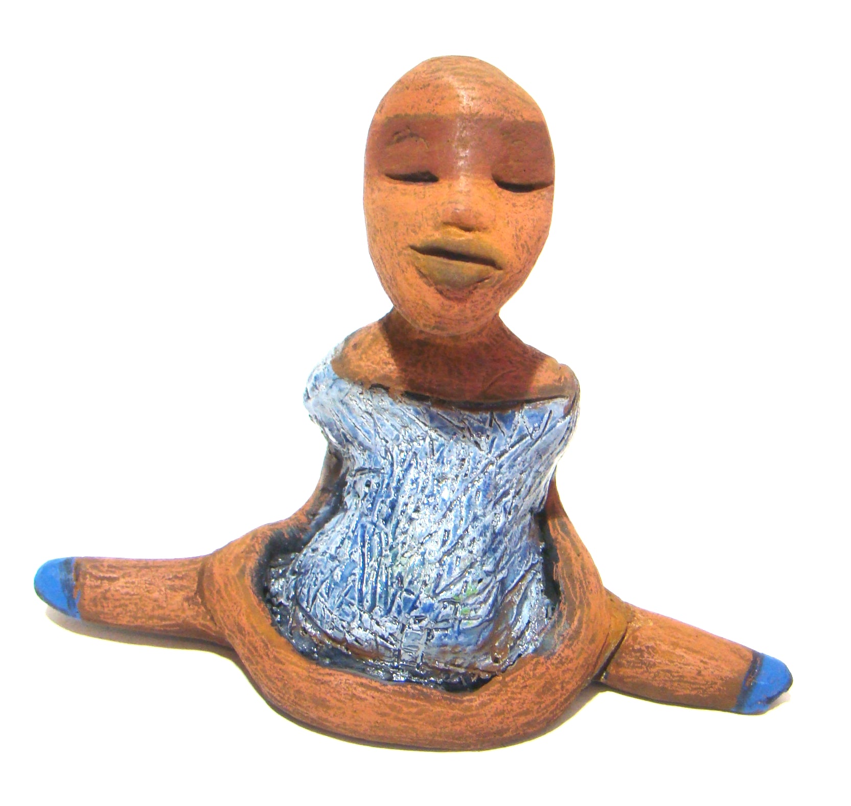 Vida sits 5" x 6" x 3" and weighs 10 ozs.     She is in a comfortable yoga pose.     Vida has a lovely honey brown complexion without hair.     Vida has a textured light blue with matching blue shoes.