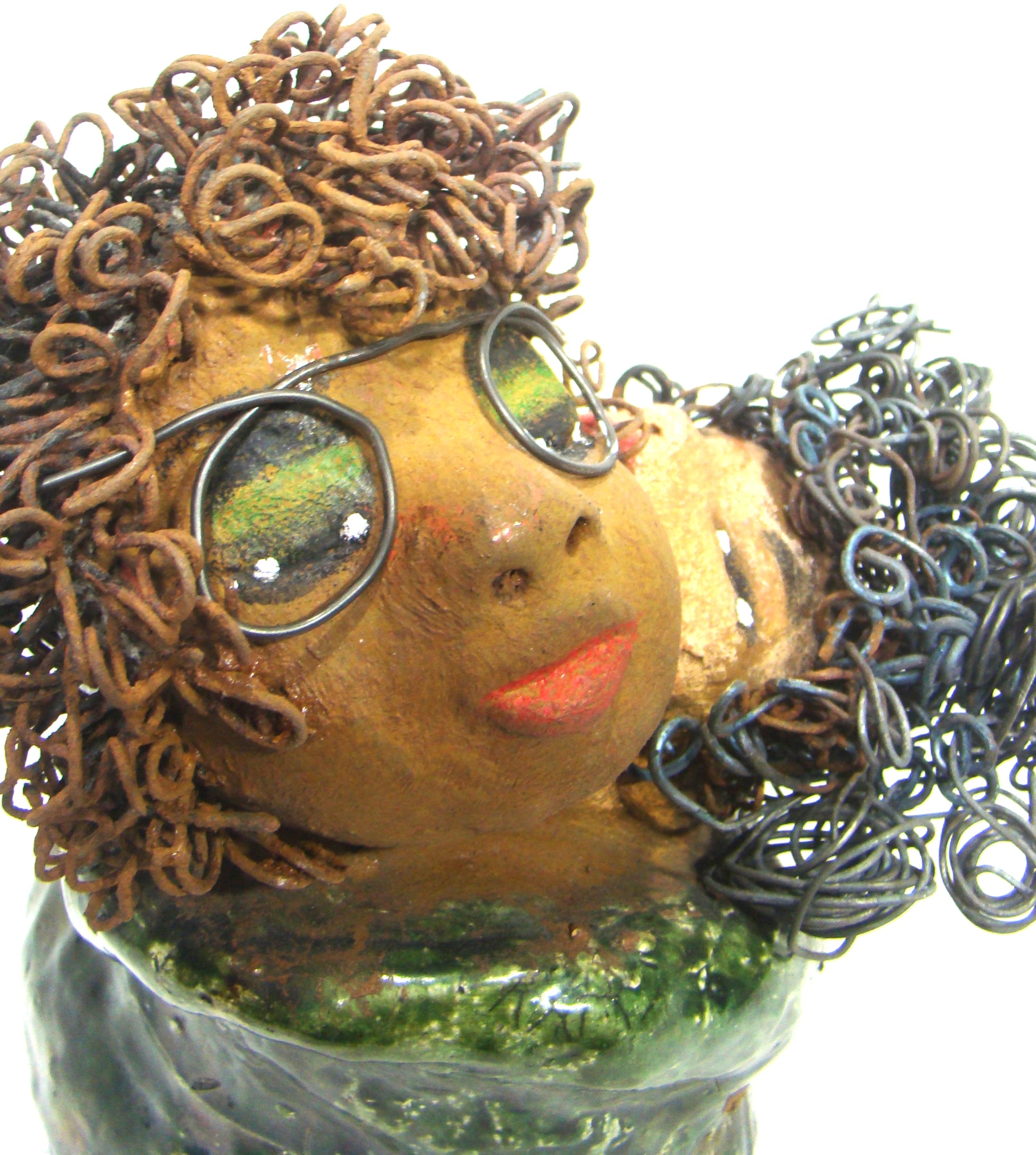 I Got You stands 10" x 6.5" x 6.5" and weighs 5.06 lbs.     They have lovely light beige and honey brown complexions.     Their dress are metallic green.     Combined I Got You has over 30 feet of curled 16 gauge wire.     The older of the two wears eyeglasses and seems to be the comforter.     I Got You will bring joy and happiness to your home.     Free Shipping!