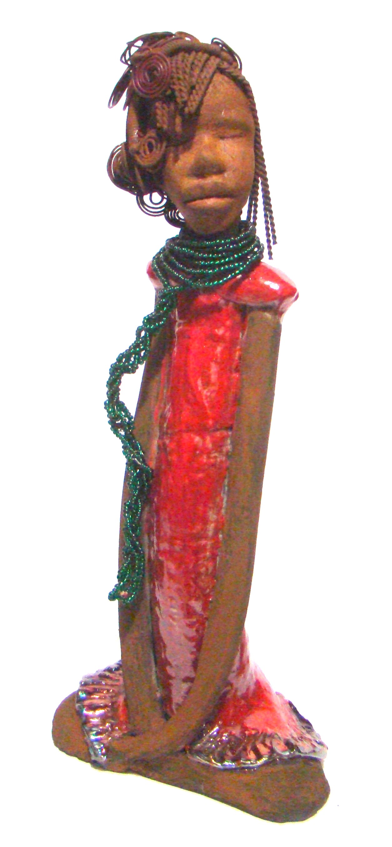 Linda stands 18" x 8" x 5" and weighs 5.1lbs. She has a lovely honey brown complexion. Her hair is rust brown. It took over 3 hours and 40 feet of coiled and spiral 16 gauge wire to complete. Linda' coiled bangs slightly covers her alluring eyes. She has  apple red dress with bright copper ruffled trim. A long  string of emerald green colored beads  cascade well below her neck. Linda favorite quote “Do what you feel in your heart to be right – for you’ll be criticized anyway.”  ― Eleanor Roosevelt With anti