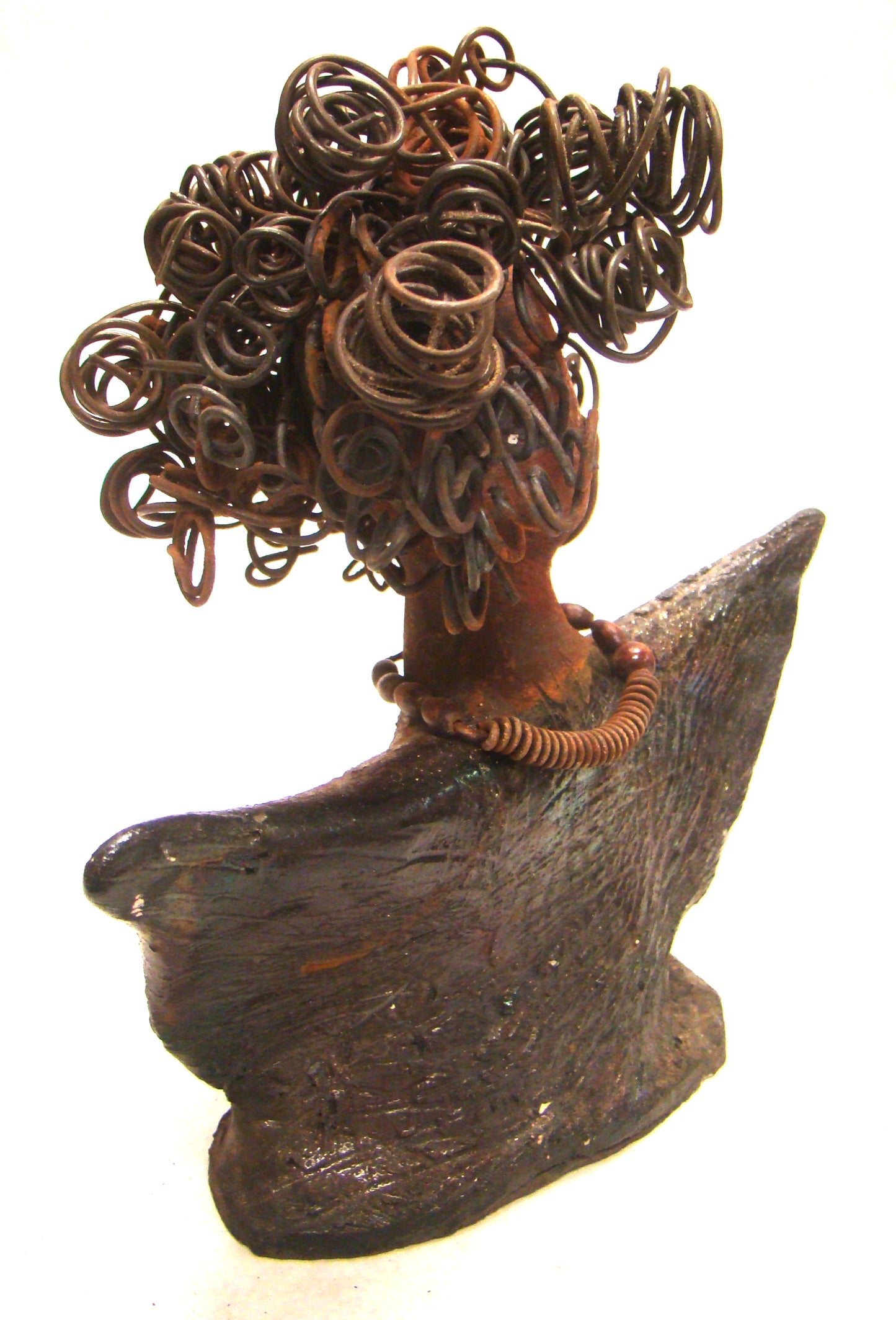 Harold stands 6" x 5" x 3" and weighs 8 ozs. He has a cocoa brown complexion with dreamy eyes. His hair is smokey gray and made of clay. Harold wears an extra large copper sweat shirt with a black collar. Harold is a great starter piece in the men Herdew collection.