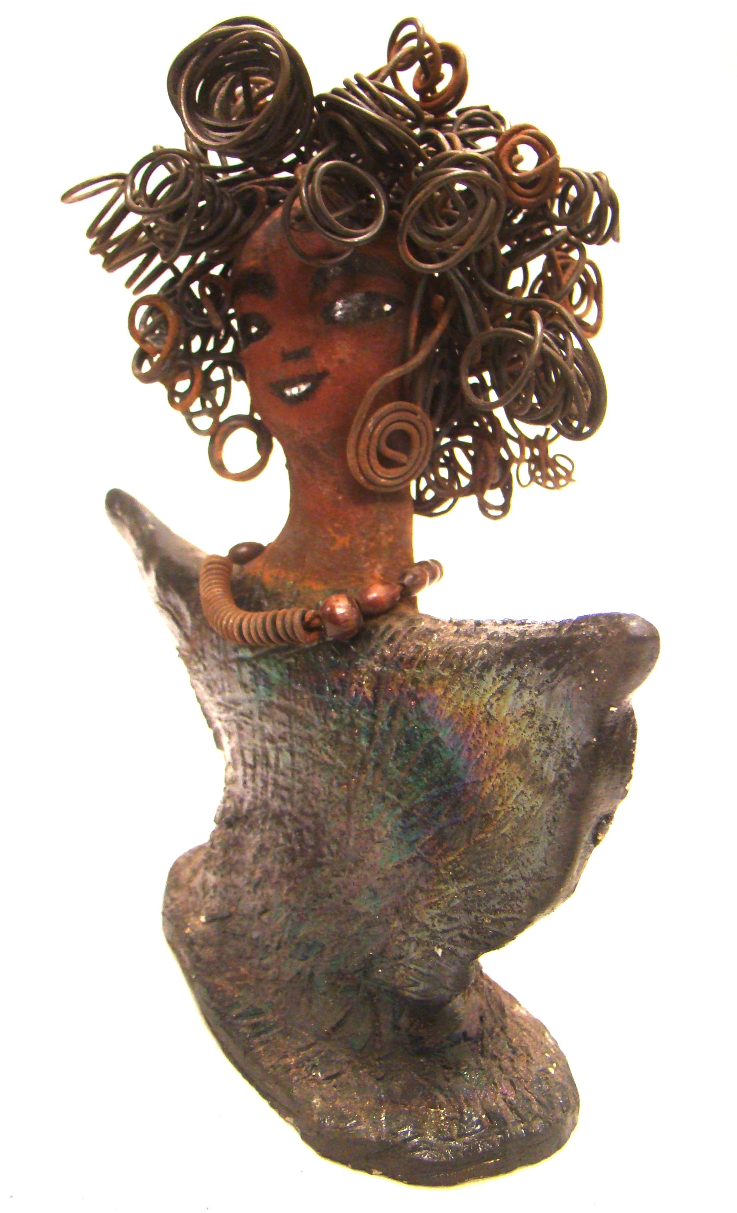 Harold stands 6" x 5" x 3" and weighs 8 ozs. He has a cocoa brown complexion with dreamy eyes. His hair is smokey gray and made of clay. Harold wears an extra large copper sweat shirt with a black collar. Harold is a great starter piece in the men Herdew collection.