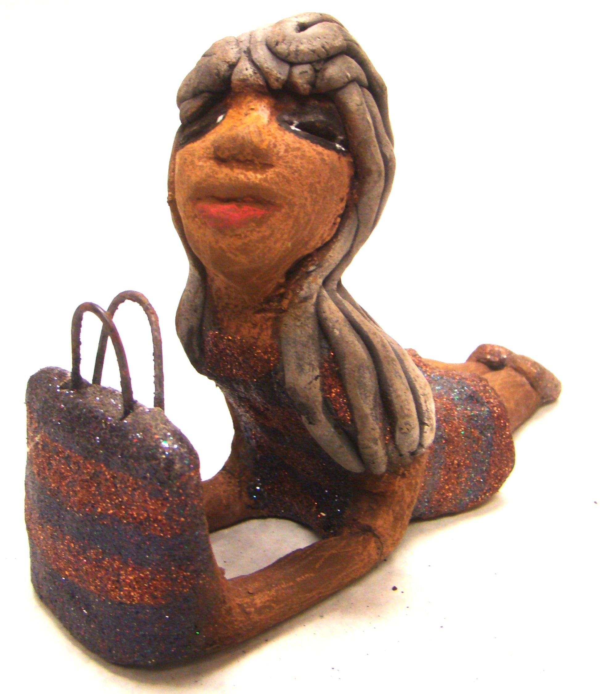 Wanda is Wishing and a Waiting !       Wanda stands 6" x 2.5" x 6" and weighs 11 ozs.     She has a lovely honey brown complexion with smokey gray clay hair.     Wanda's copper and green striped dress matches her bag.     Her long loving arms are outstretched with bag in hand.  Wanda is wishin and a waiting on You!