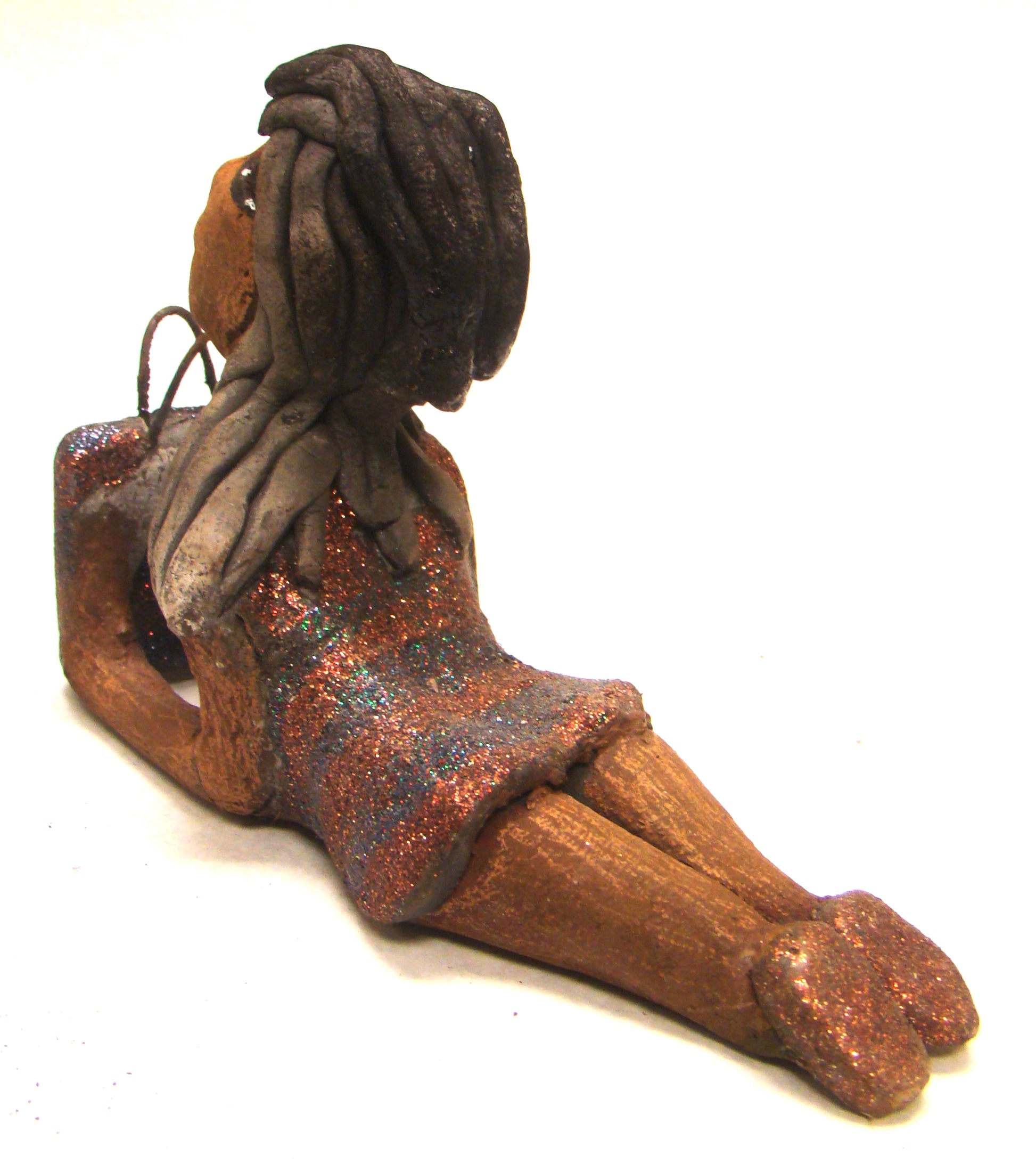 Wanda is Wishing and a Waiting !       Wanda stands 6" x 2.5" x 6" and weighs 11 ozs.     She has a lovely honey brown complexion with smokey gray clay hair.     Wanda's copper and green striped dress matches her bag.     Her long loving arms are outstretched with bag in hand.  Wanda is wishin and a waiting on You!