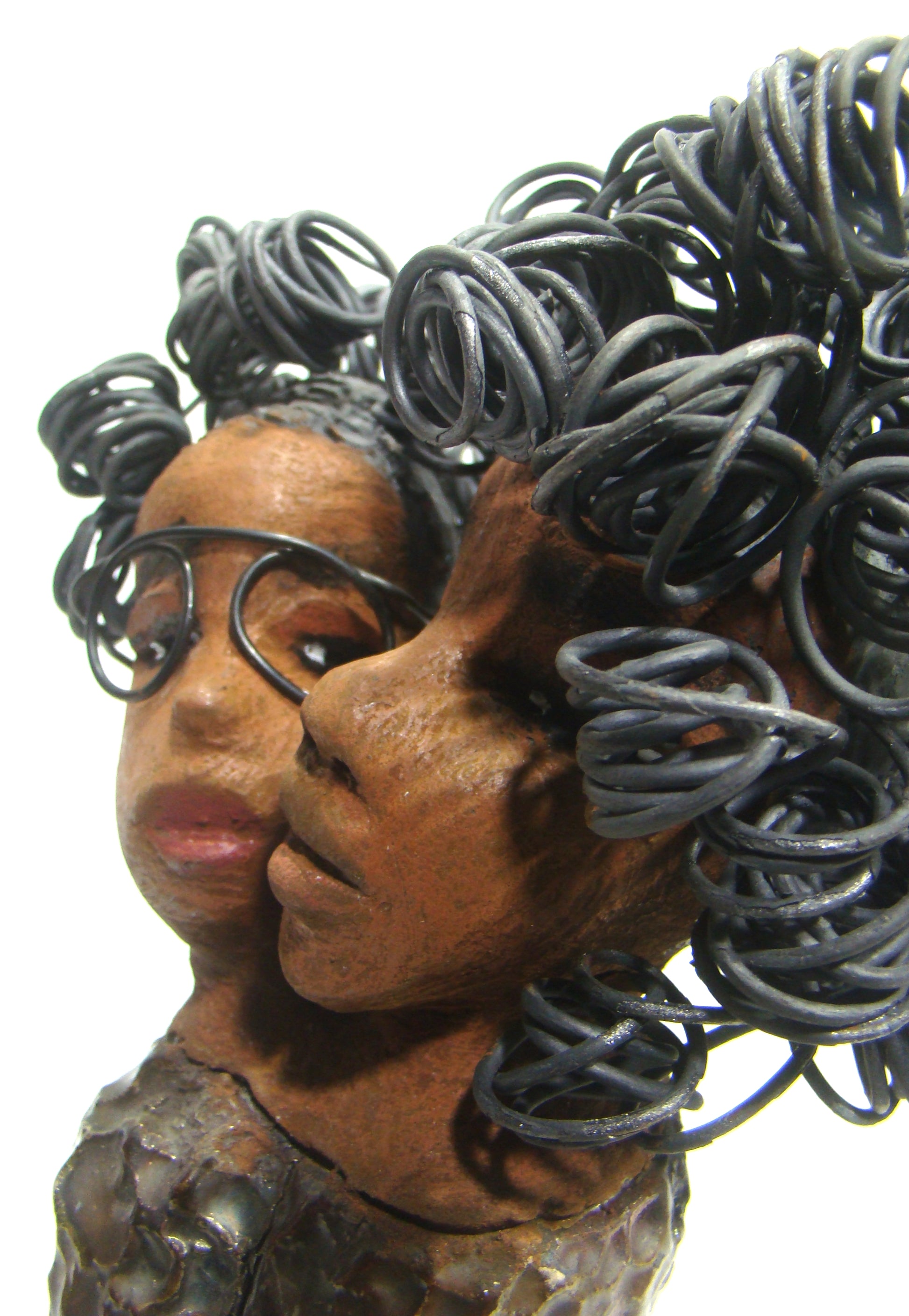 My BFF stands 13" x 8" x 4" and weighs 4.13 lbs.     Both girls have lovely honey brown complexions.     Their dresses are textured and have copper metallic glazes.     The long loving arms of My BFF embrace one another with love.     My BFF has over 25 feet of curly 16 gauge wire hair.     My BFF represents the close bond and friendship that has developed between all women of every race, ethnicity, and color.     My BFF will make an excellent gift to your BFF!     Free Shipping!