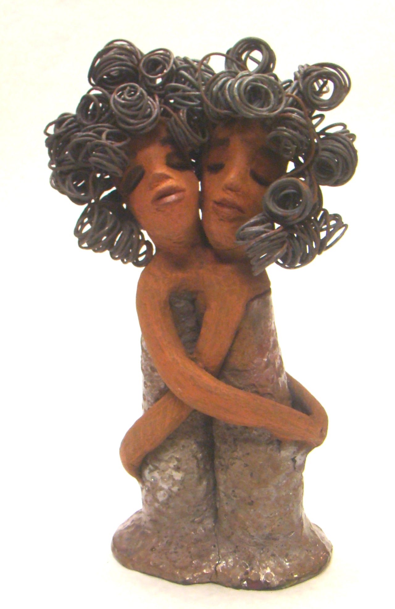 Sister Love stands 11" x 5" x 3" and weighs 2.06 lbs. Combined they have over 45 feet of curled 16 gauge wire hair. The dresses are textured with an antique copper glaze. They have lovely honey brown complexions. Sister Love is inseparable! Give them a special place in your home. Free Shipping!
